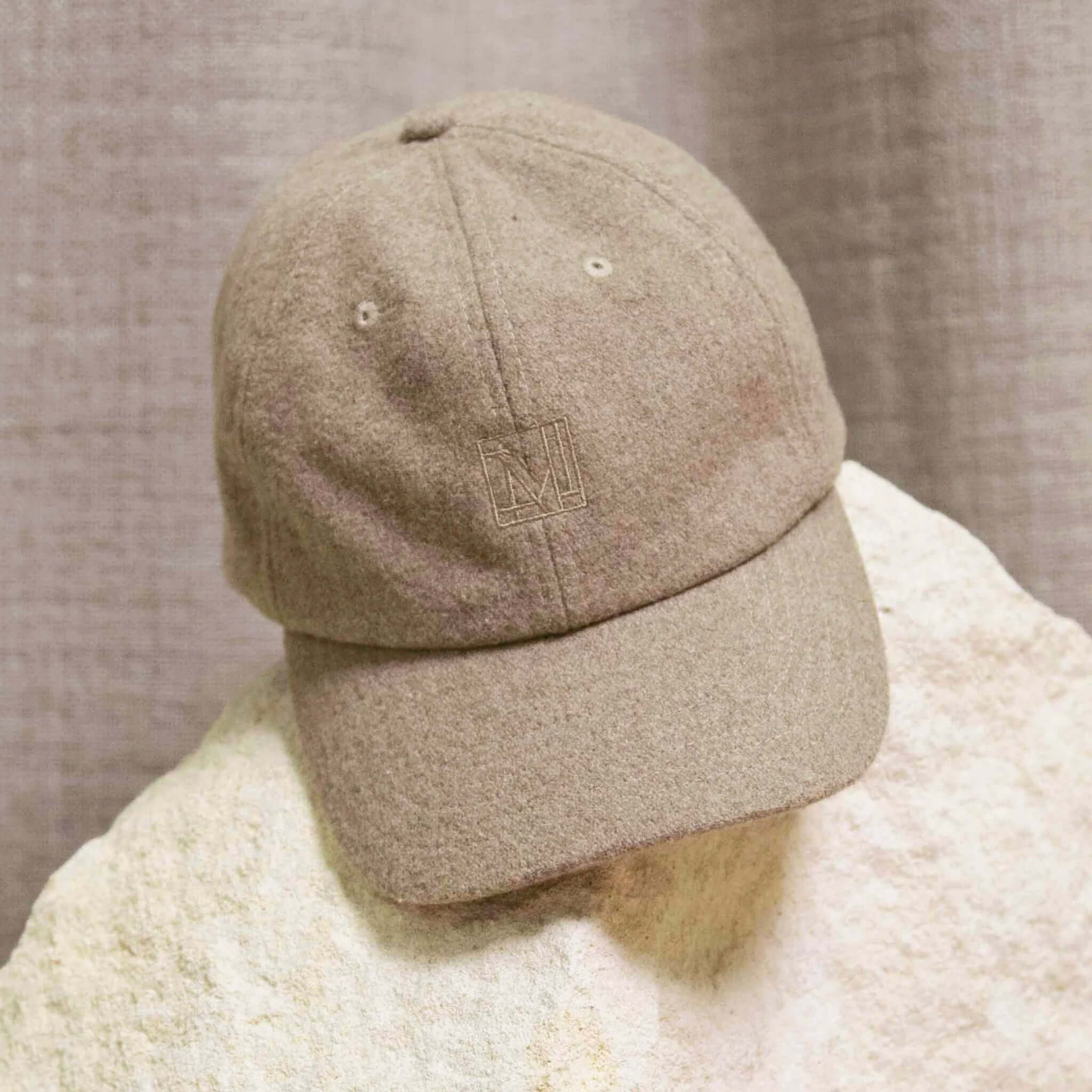 Alt Tag: Marlow Wool Cap in ivory wool blend, classic 6-panel women’s cap with adjustable strap and breathable eyelets