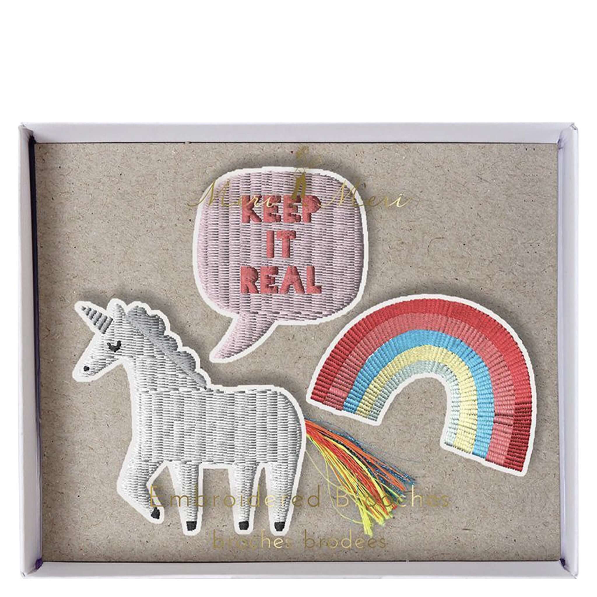 Alt Tag: Meri Meri Embroidered Brooch Set - Unicorn embroidered unicorn, rainbow and "keep it real" brooches in gift box