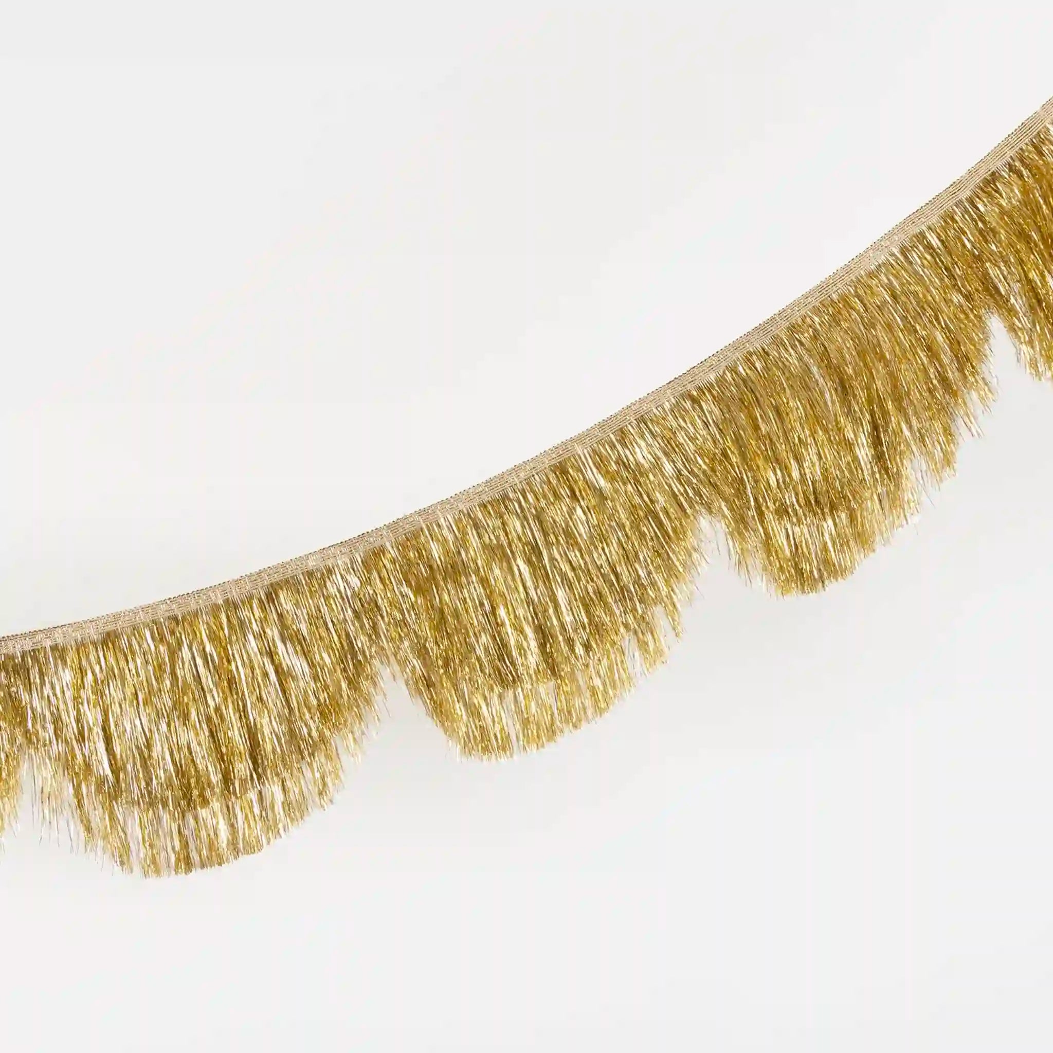 Gold fringe garland on a white background