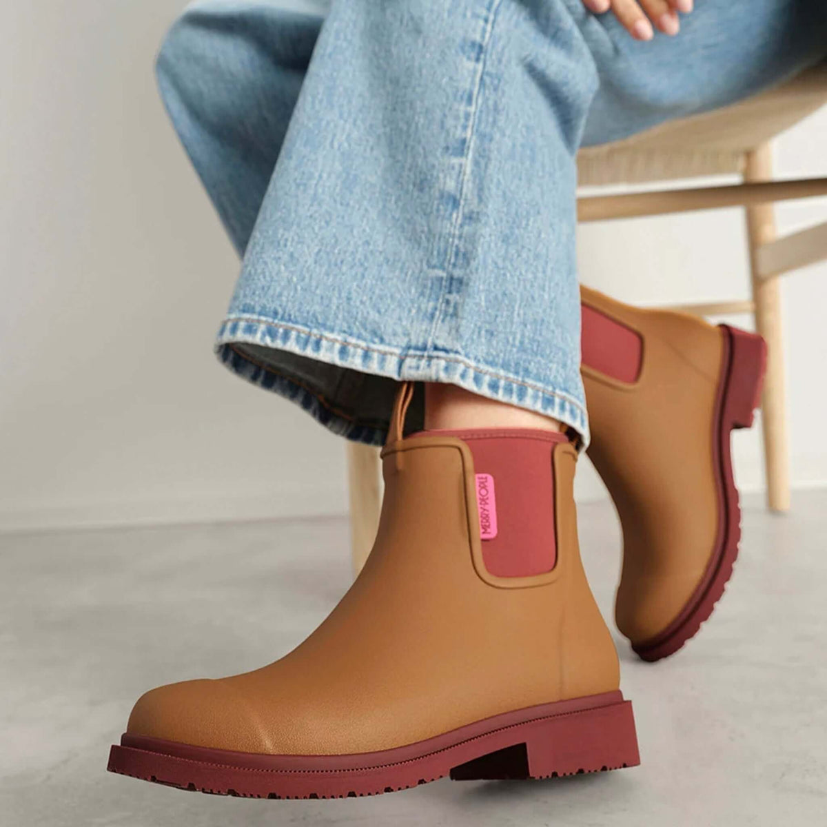 Merry People Bobbi Ankle Boots - Ochre showcased with casual denim, highlighting stylish rain footwear. 