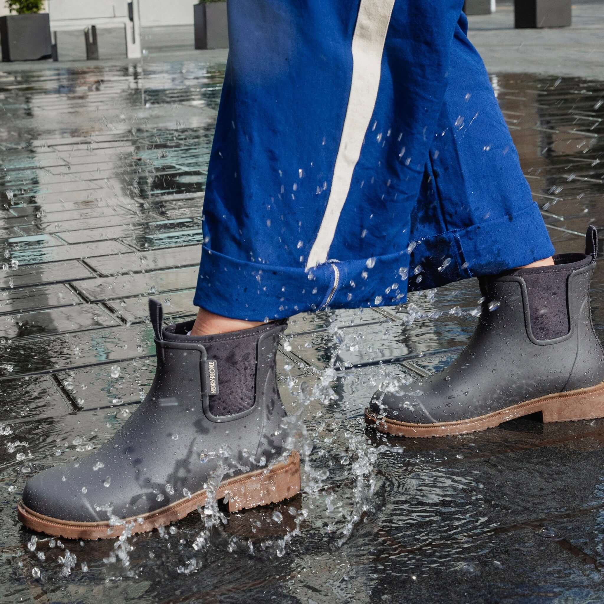 Merry People Bobbi Ankle Boots - Charcoal splashing through puddles on a rainy day.