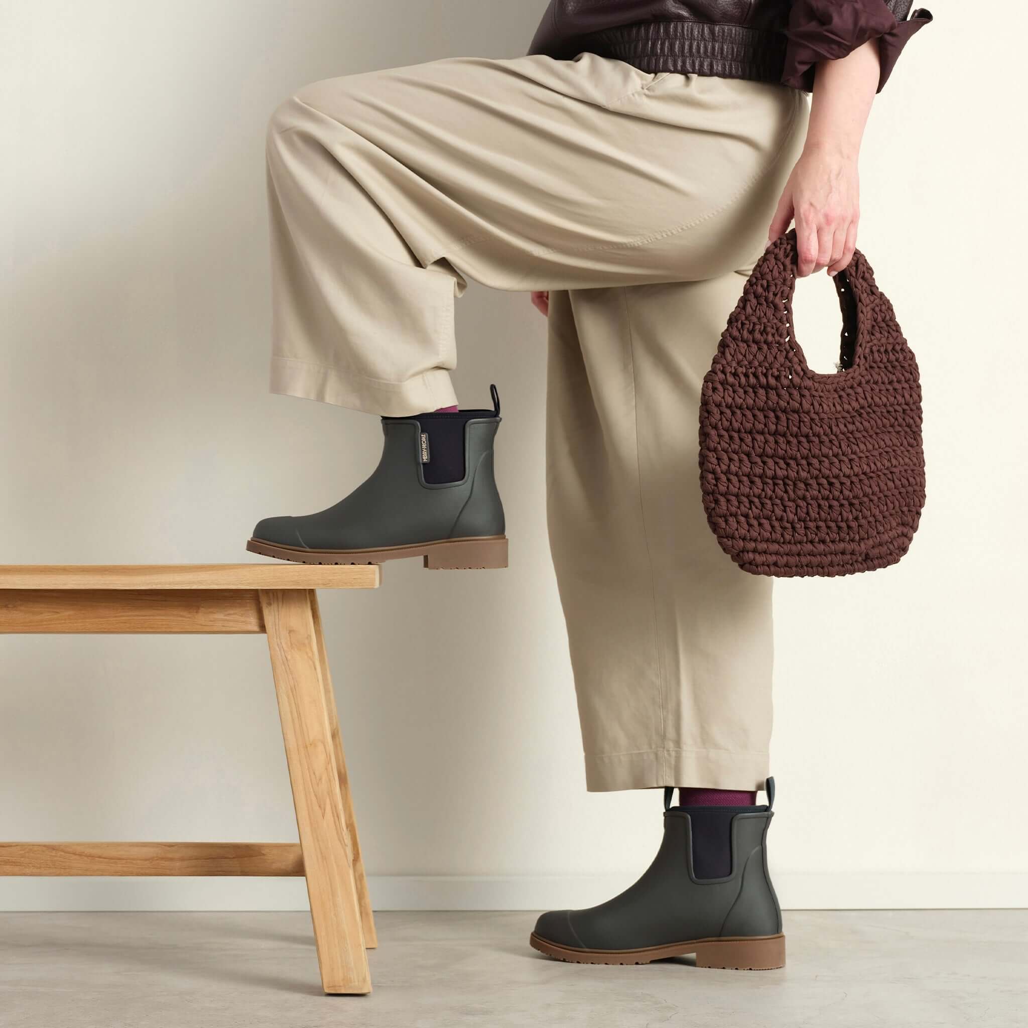 Merry People Bobbi Ankle Boots - Charcoal worn with stylish outfit and a brown bag against neutral background.
