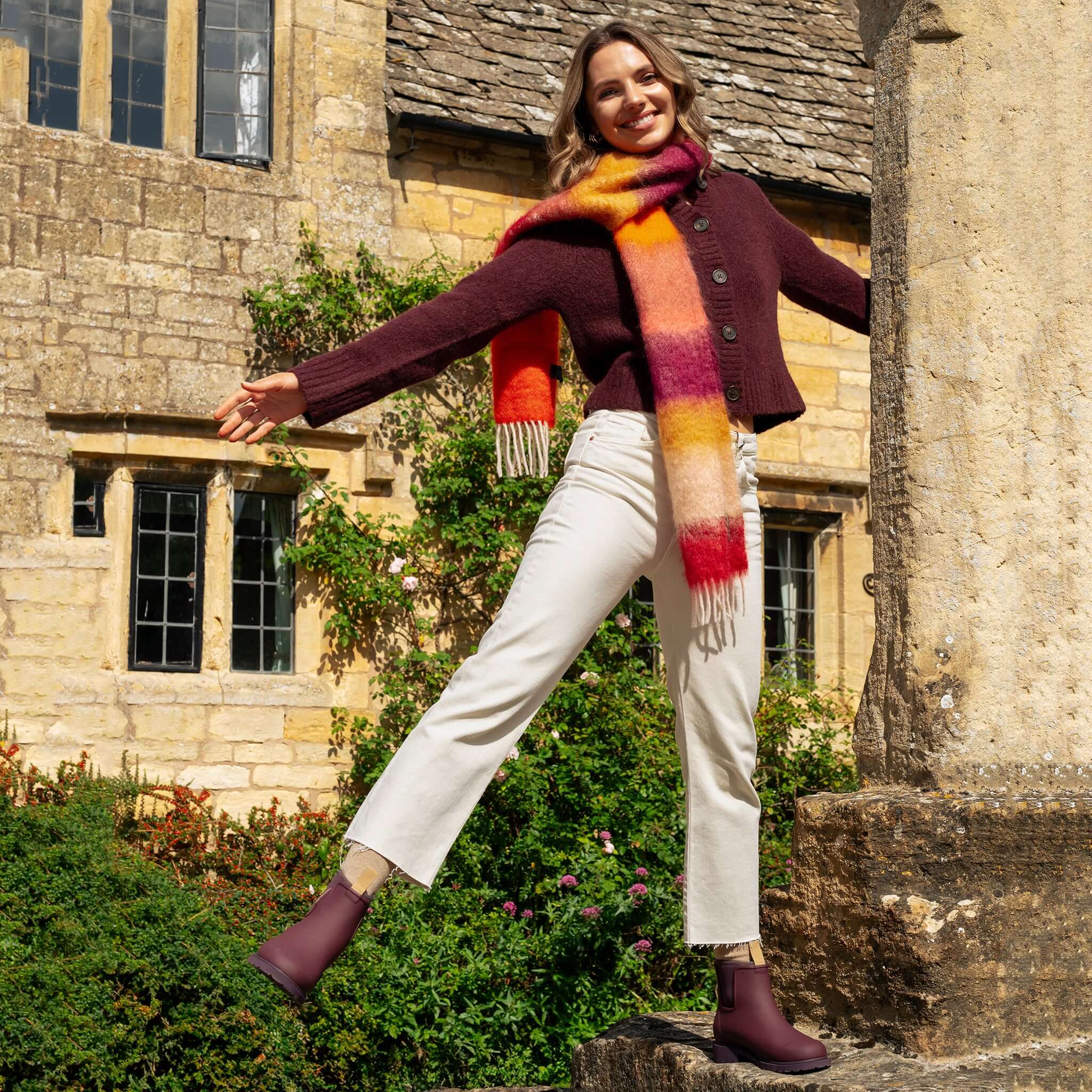 Merry People Bobbi Ankle Boots - Dark Cherry worn by a smiling woman in a colorful scarf outdoors.