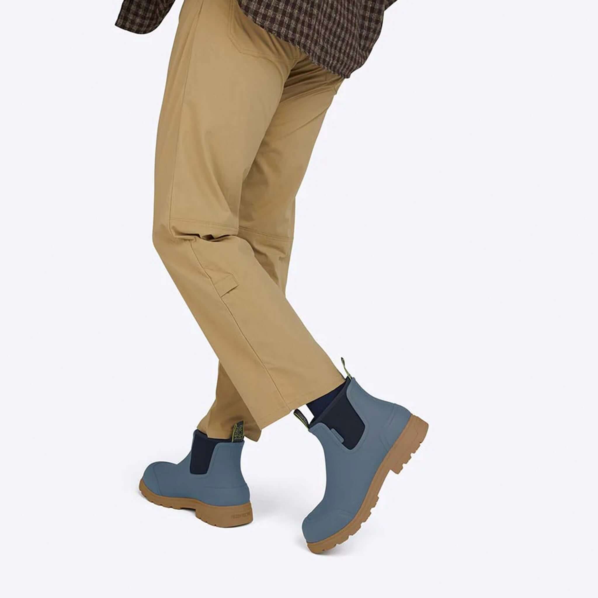 Alt Tag: Merry People Oberon Boots - Storm Blue unisex wide-fit waterproof rubber boots on model, storm blue with gum sole
