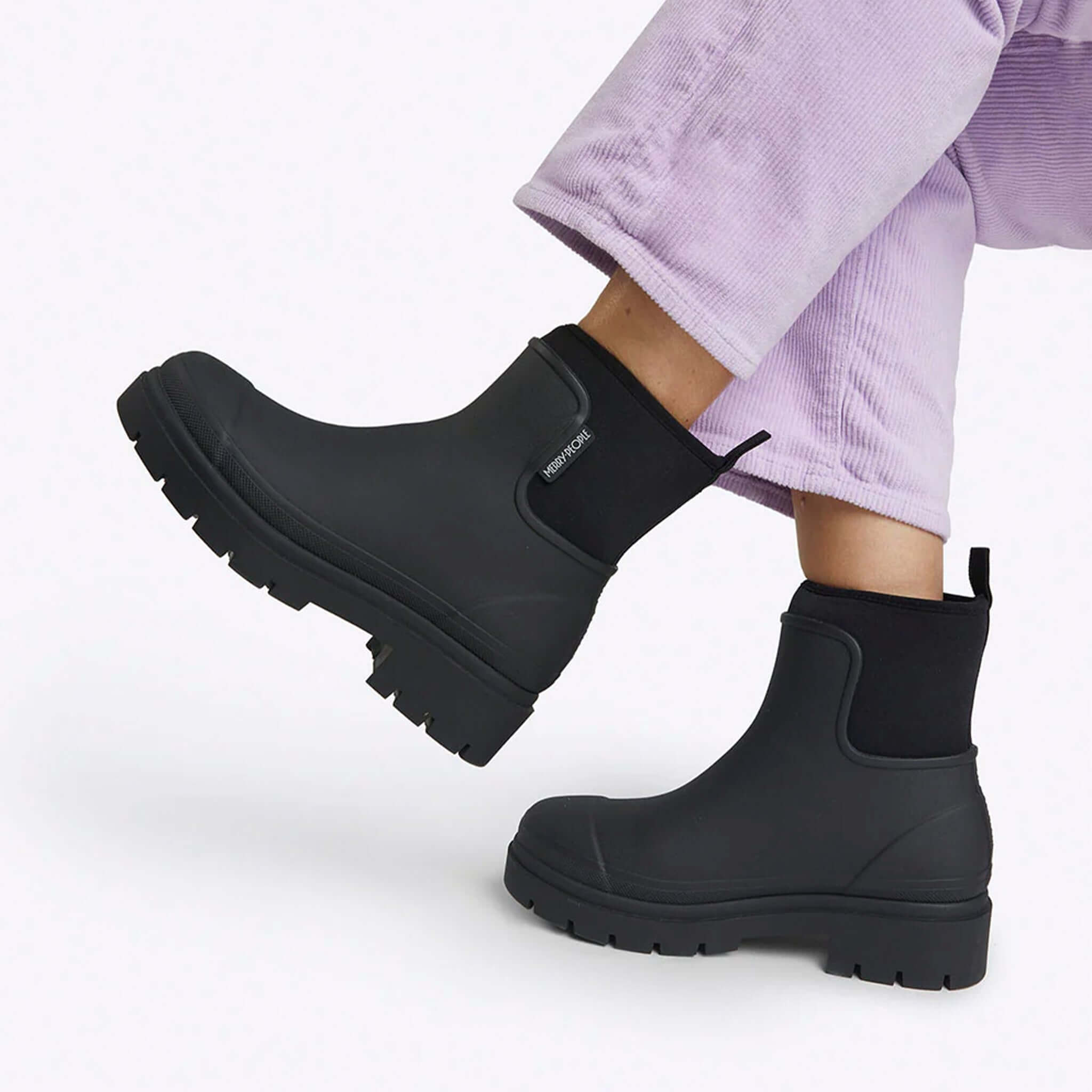 Alt Tag: Merry People Tully Boots - Black chunky platform waterproof vegan rubber ankle boots with neoprene cuff, 90s-inspired urban gumboots