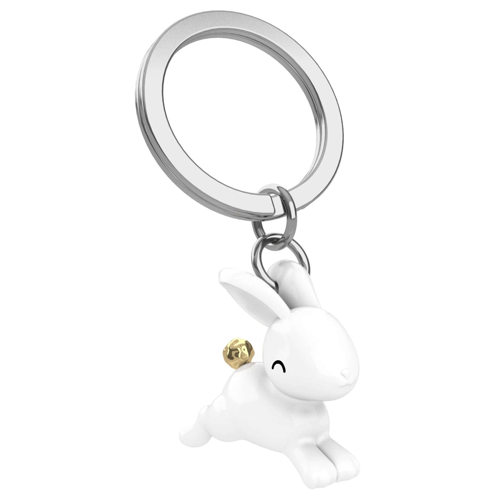 Alt Tag: Meta[l]morphose Keychain - Flying Bunny zinc alloy keychain with white flying bunny charm and gold pom-pom tail
