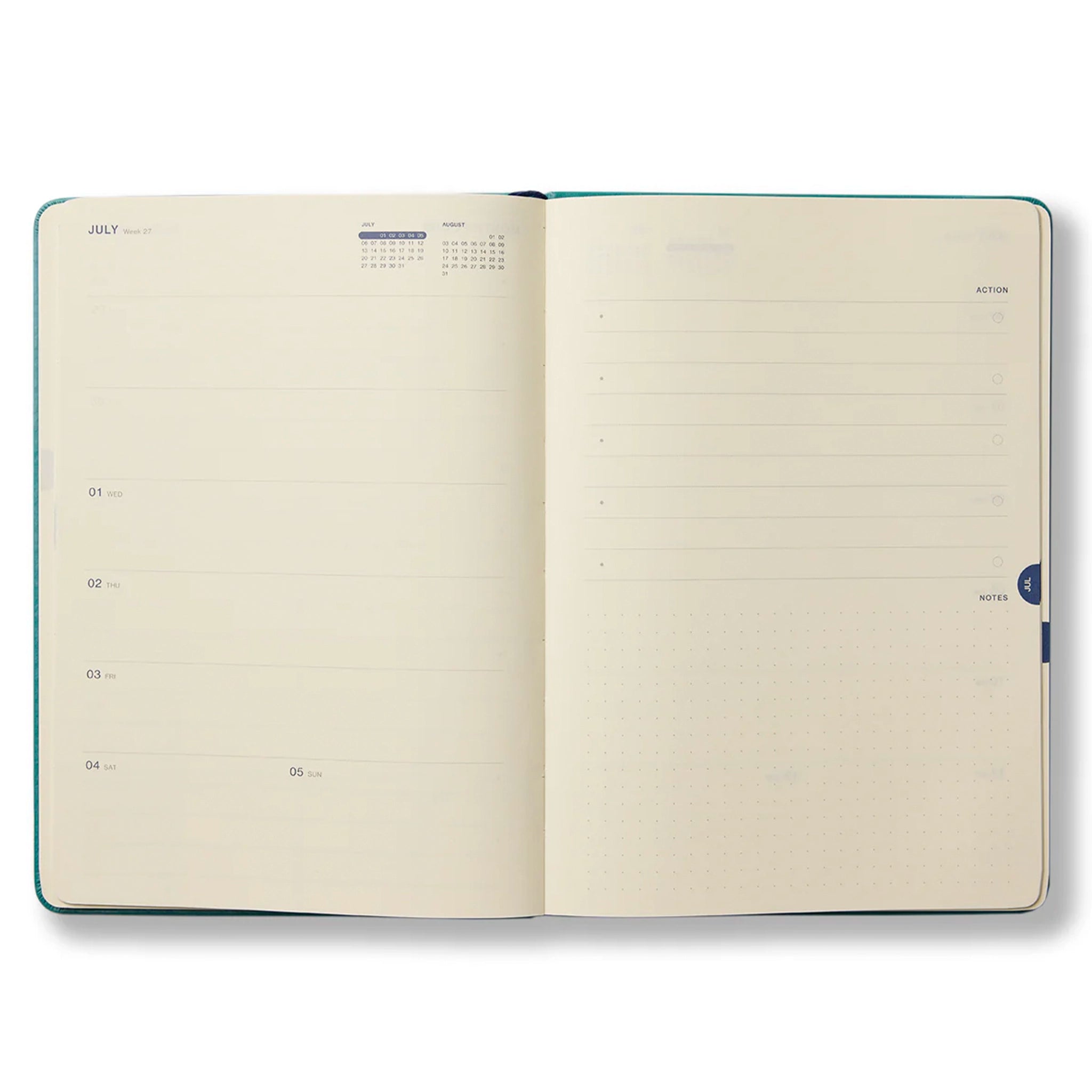 Open planner with July calendar on a white background