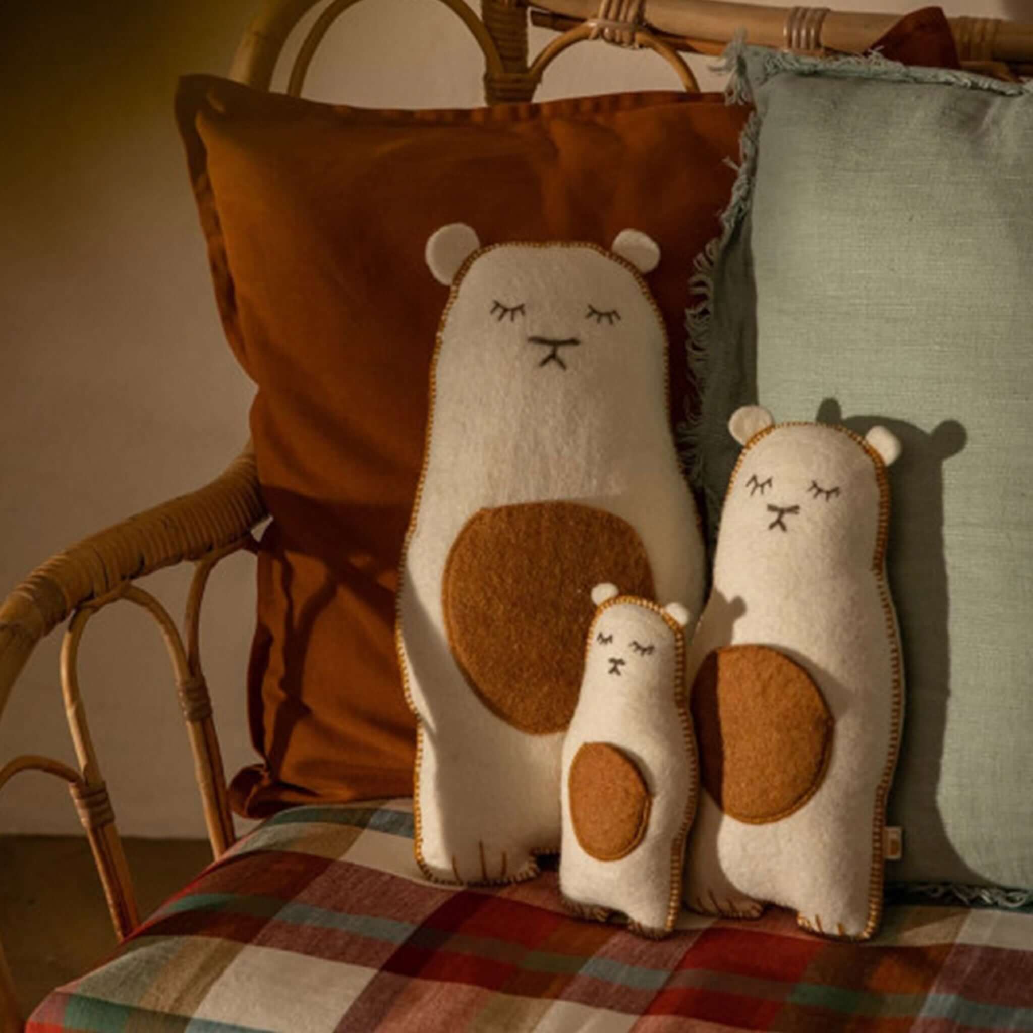 Muskhane Grizzly Pasu Felt & Kapok Cushion - Natural displayed on a cozy sofa with colorful cushions.