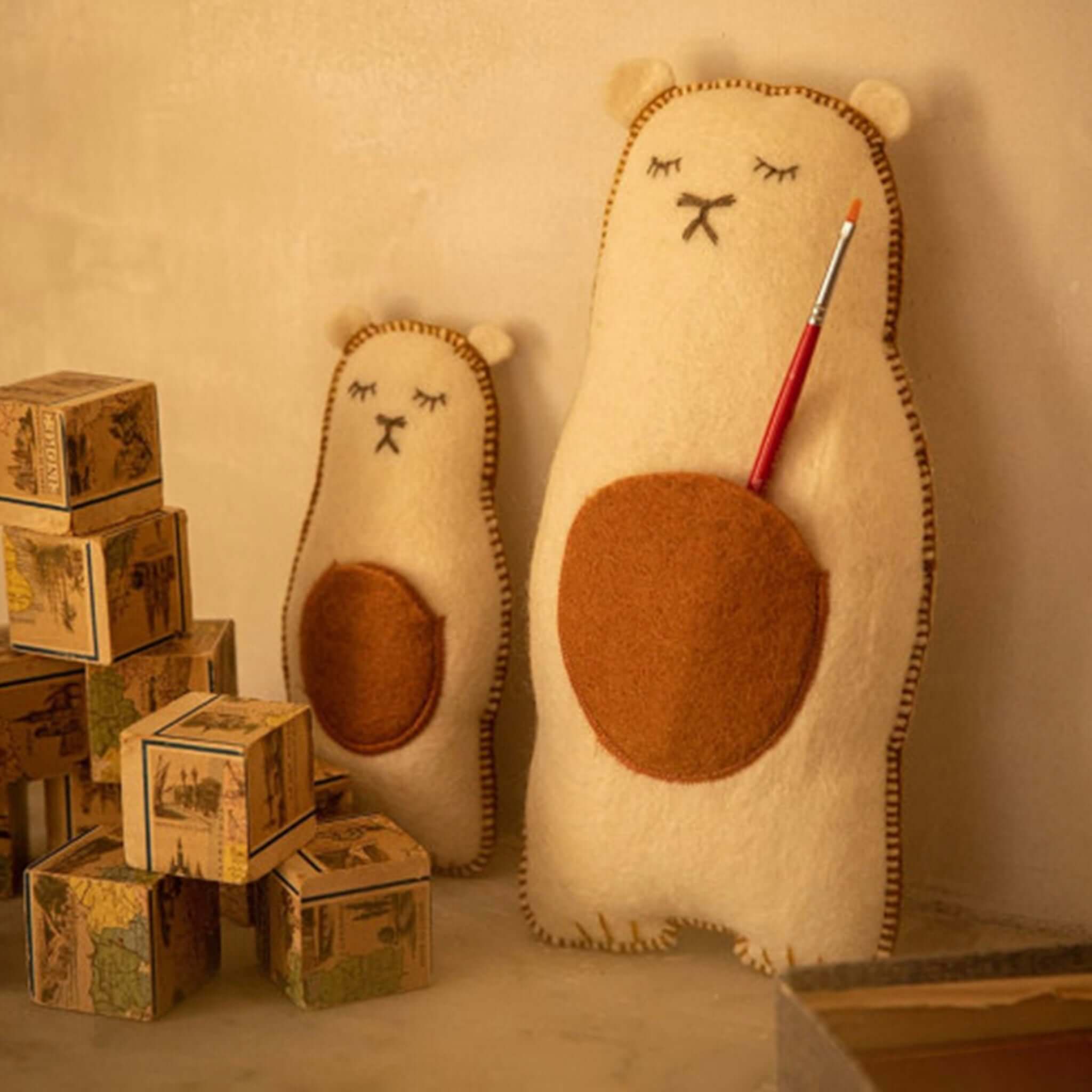 Muskhane Grizzly Pasu Felt & Kapok Cushion - Natural, adorable bear cushions in cream and caramel. Perfect bedroom addition.