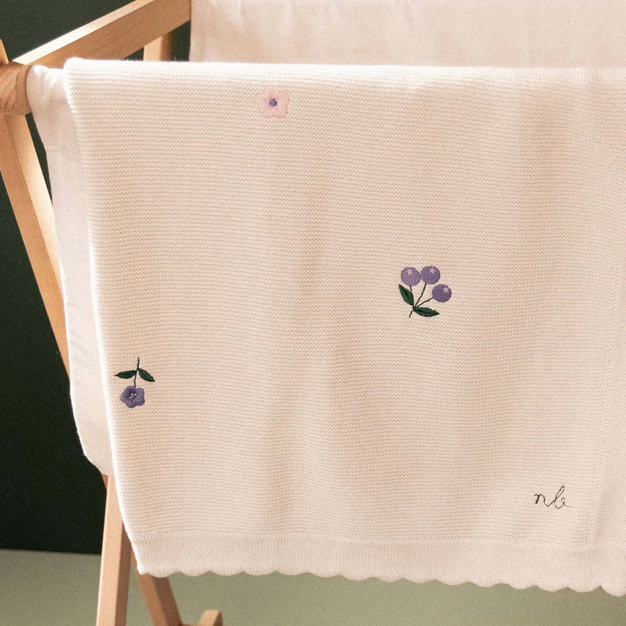 Alt Tag: Nature Baby Organic Cotton Fern Blanket - Berry Garden organic cotton knit baby blanket with floral embroidery and scalloped edge