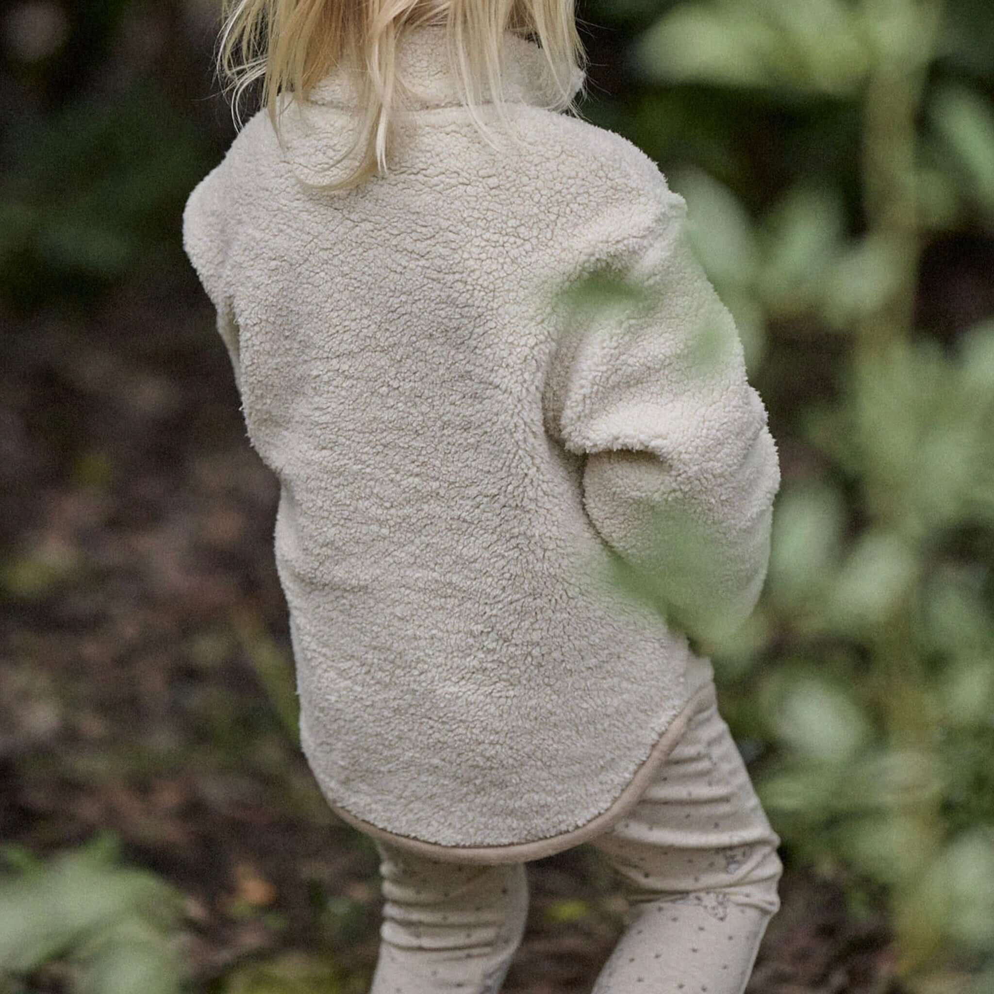 Alt Tag: Nature Baby Organic Cotton Leggings - Bramble Burrow on baby outdoors, soft GOTS organic cotton leggings with comfy elastic waist