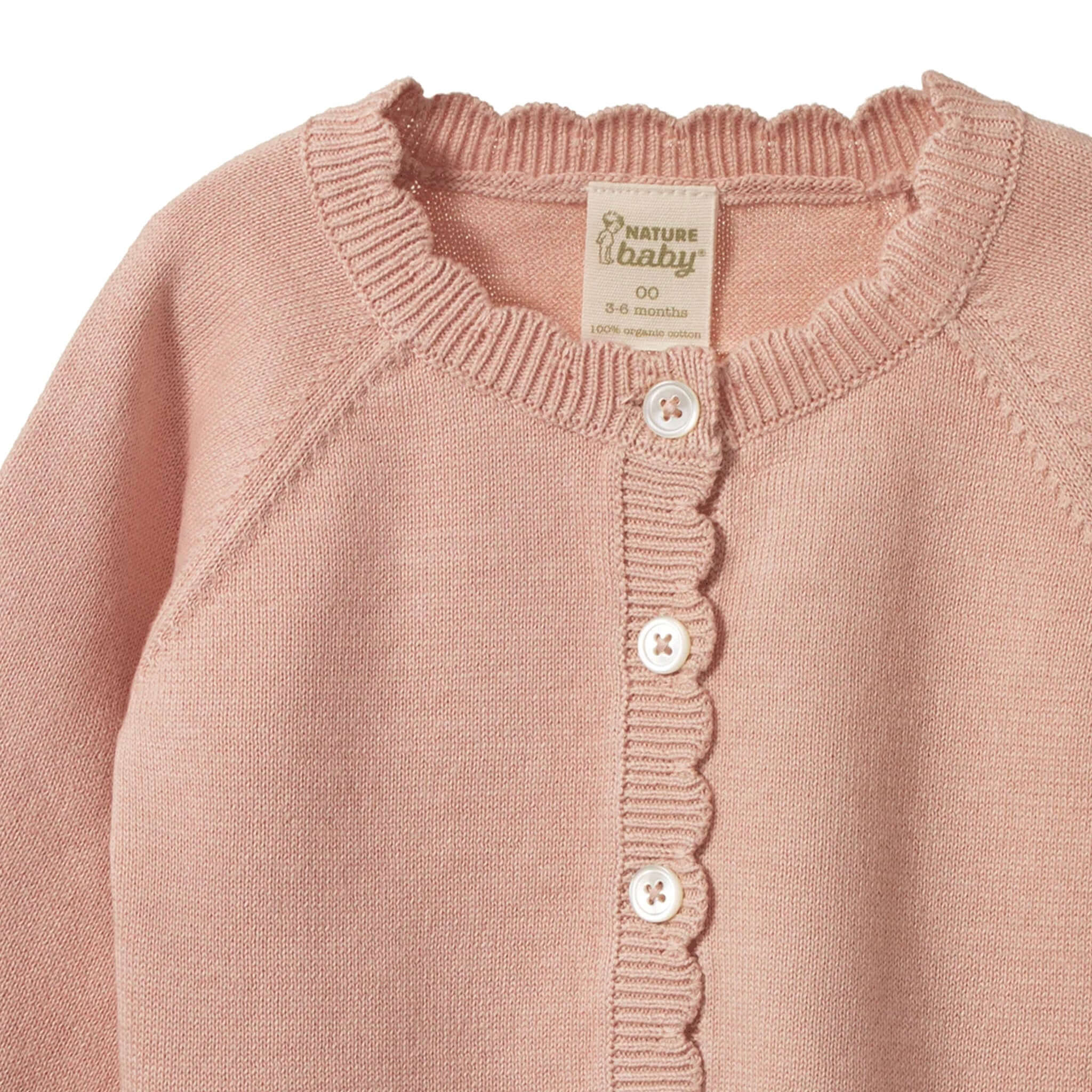 Nature Baby Organic Cotton Liliette Cardigan - Rose Dust close-up showcasing scalloped trim and button details.