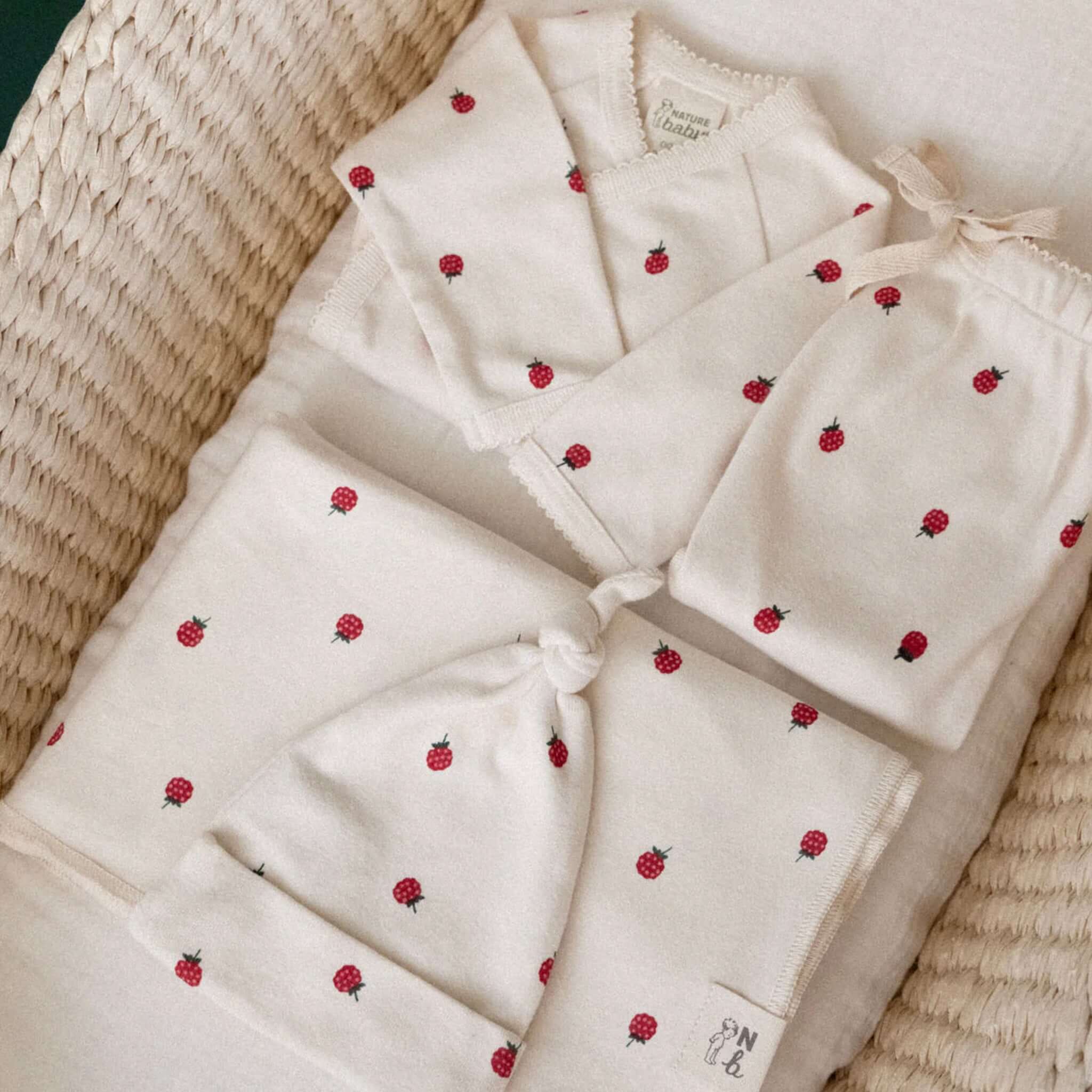 Alt Tag: Nature Baby Organic Cotton Welcome Home Bundle - Raspberry organic GOTS cotton kimono bodysuit, beanie and wrap with raspberry print