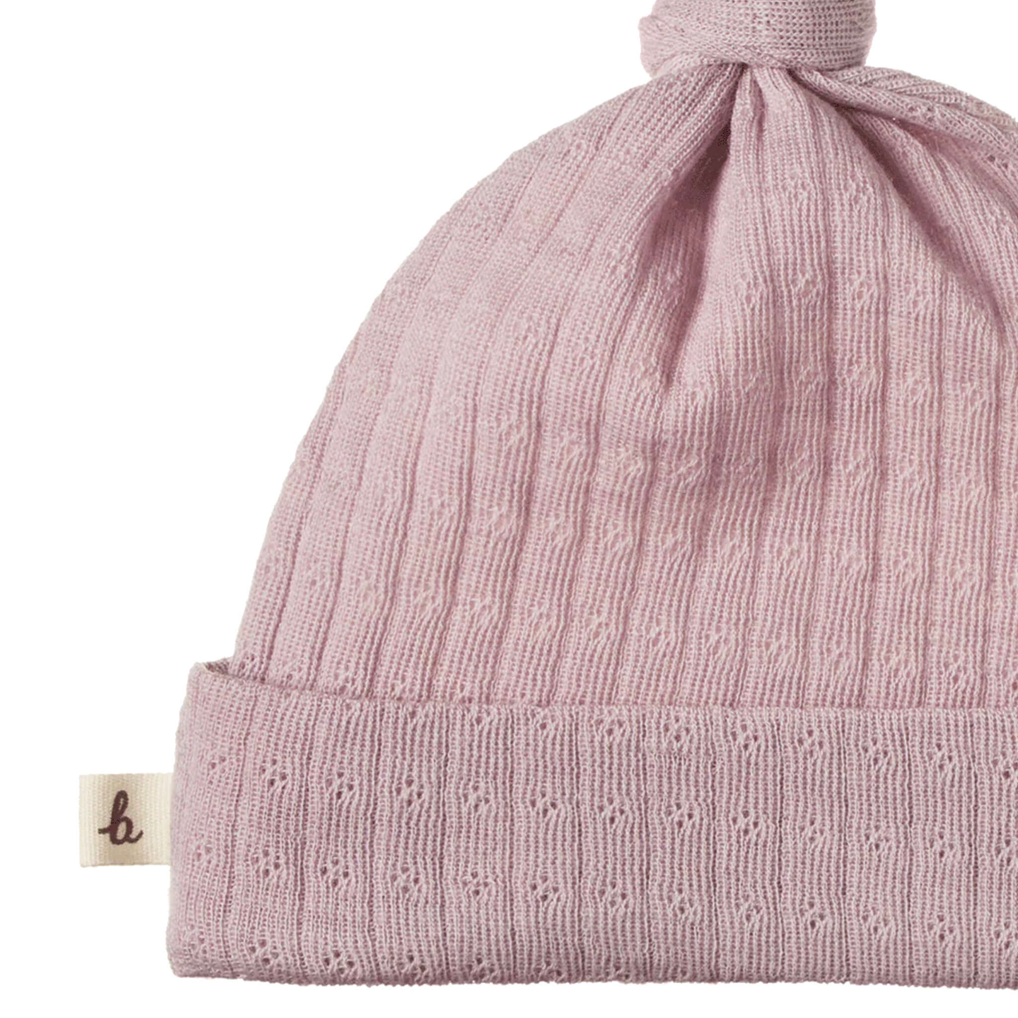 Alt Tag: Nature Baby Organic Merino Knotted Beanie - Pointelle Lilac baby beanie in lilac organic pointelle merino wool with adjustable knot