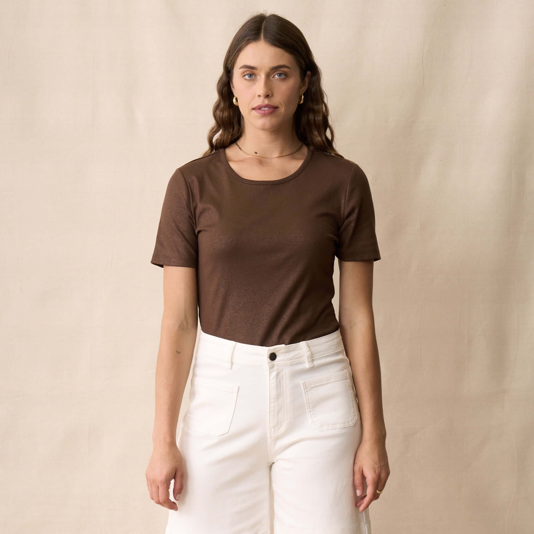 Neris Ziggy Tee - Copper model wearing soft cotton tee with shimmer in front of neutral background.