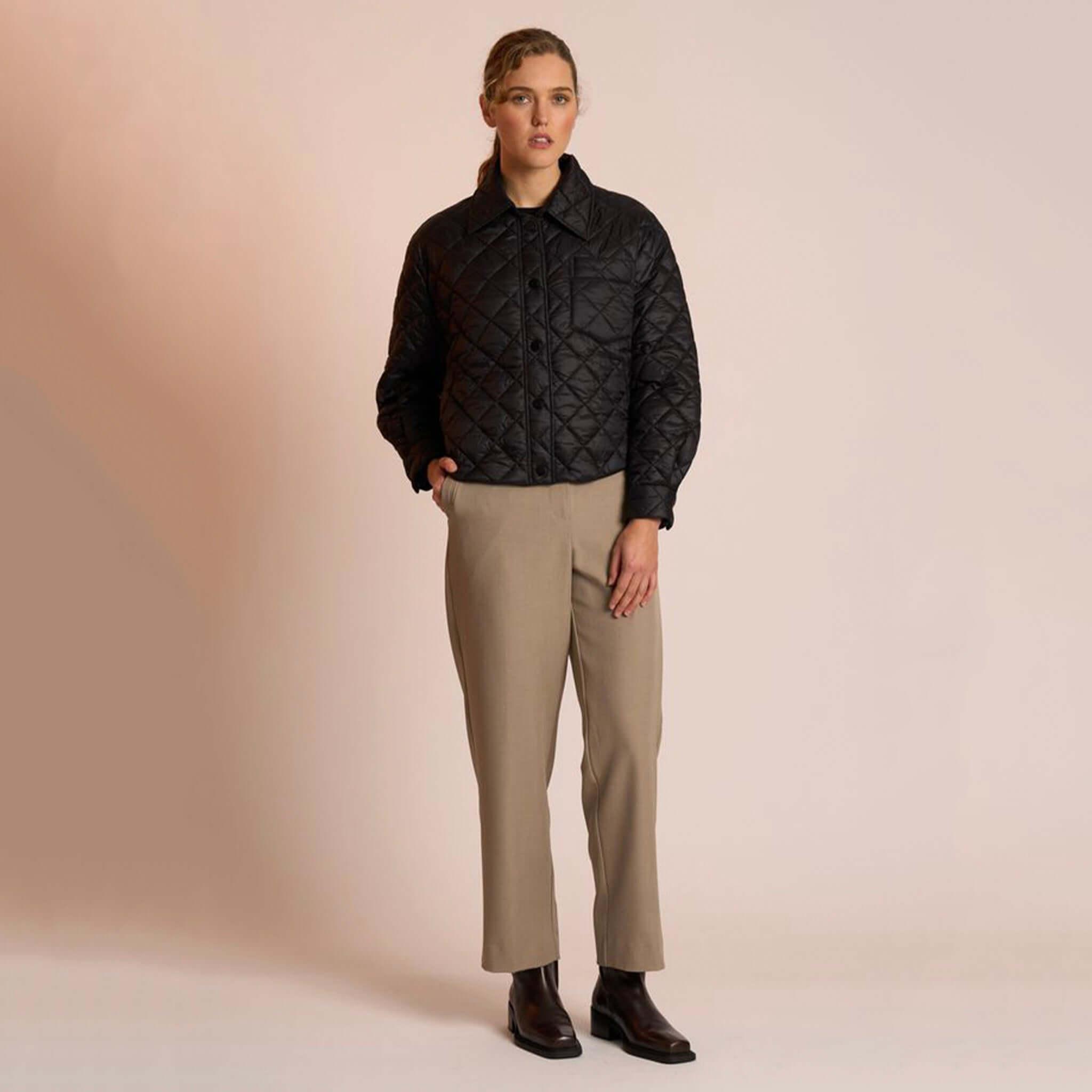 Neris Gia Jacket - Jett quilted cropped jacket with snap domes and collar, styled on model with trousers and boots