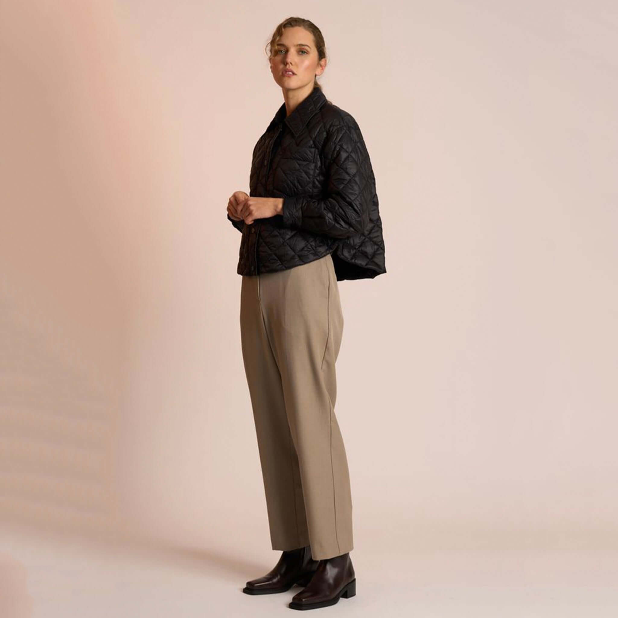 Alt Tag: Neris Gia Jacket - Jett quilted cropped jacket with structured collar and snap domes, styled on model