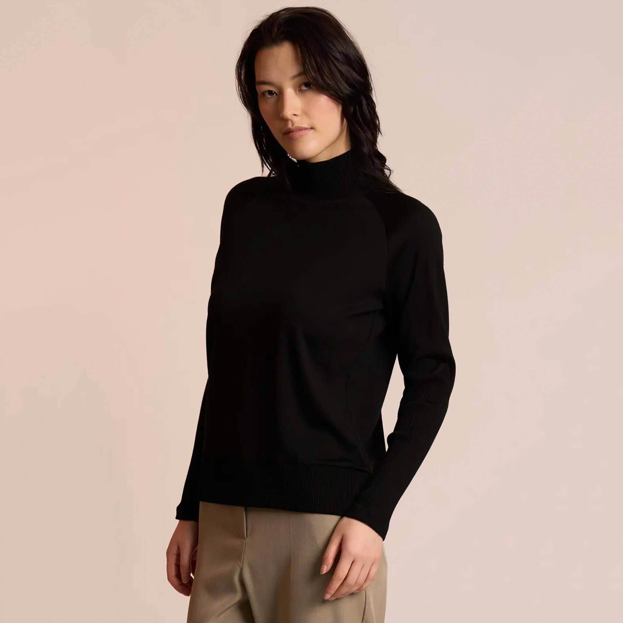 Alt Tag: Neris Side Story Merino Jumper - Black 100% merino wool funnel neck knit, relaxed fit lightweight warm layering essential