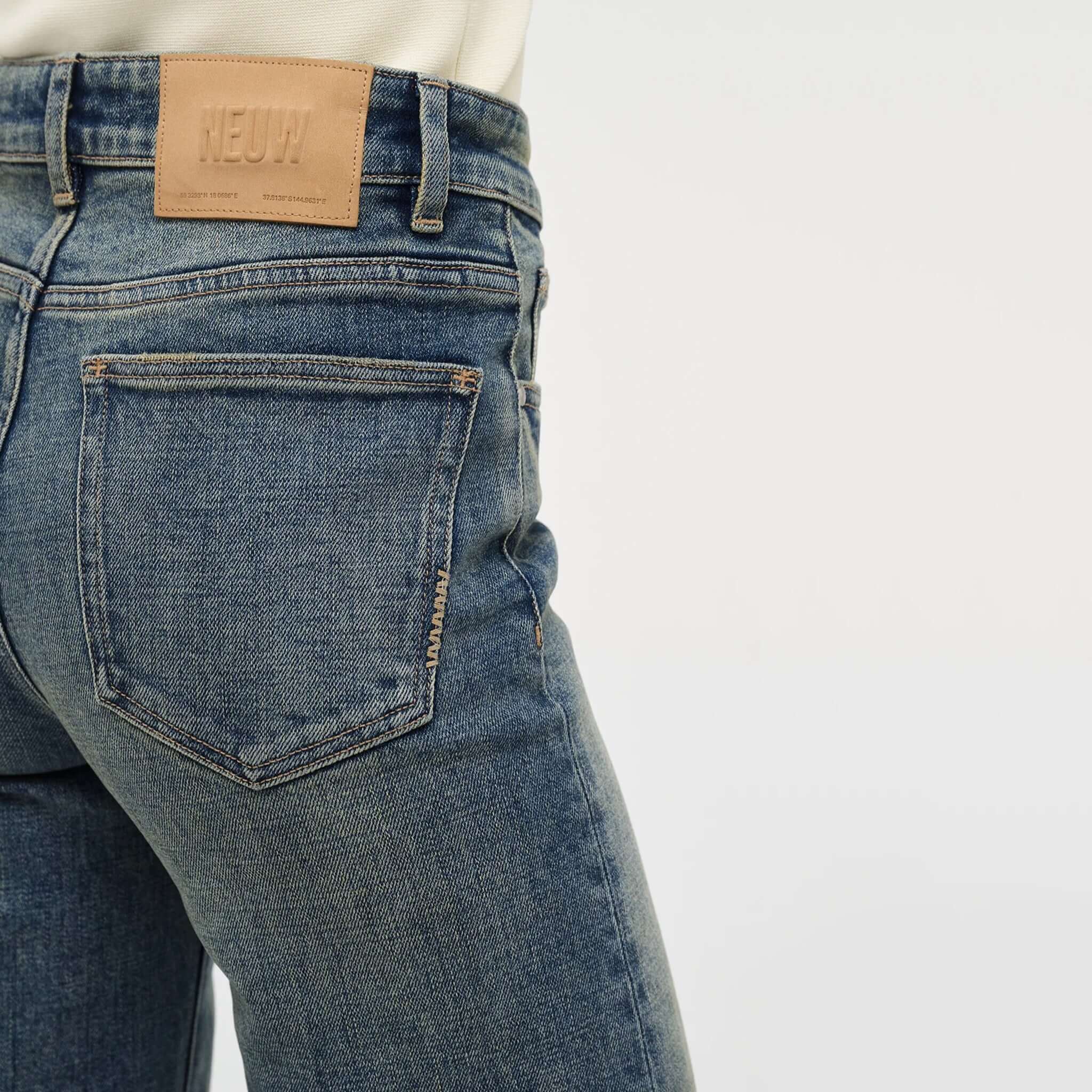 Alt Tag: Neuw Eva Wide Jeans - Mid Vintage Indigo back pocket detail in comfort-stretch denim, mid-rise wide leg jeans