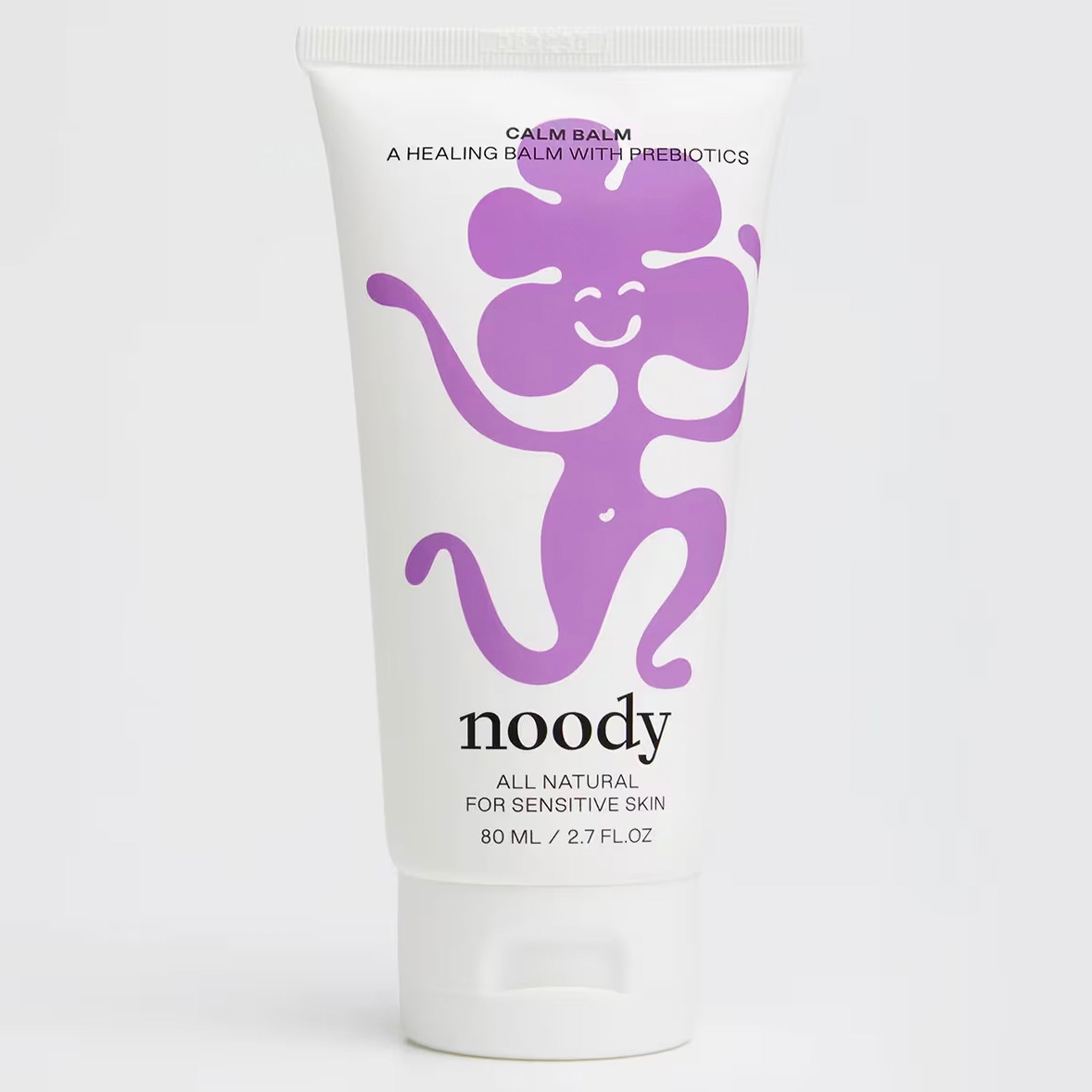 Noody balm tube with purple monkey illustration on a white background