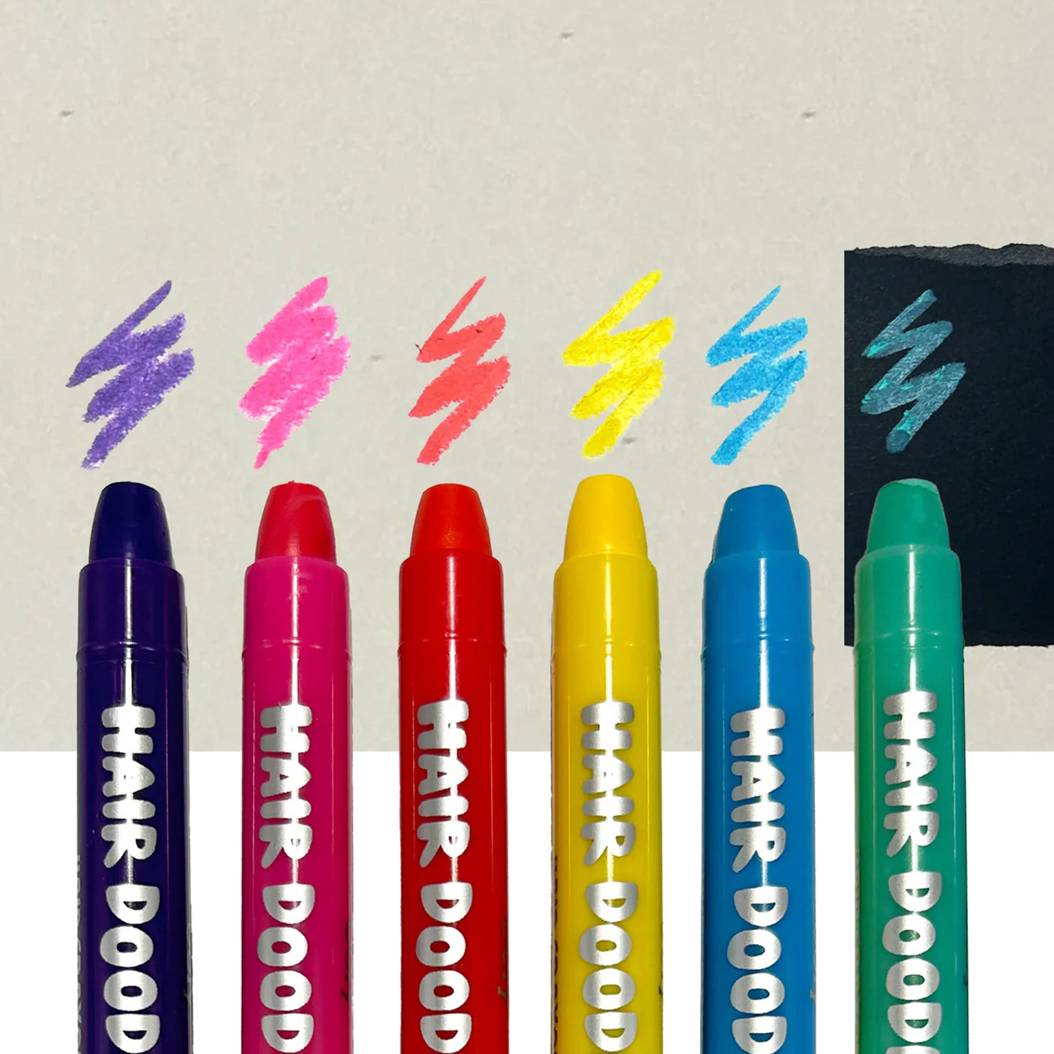 Set of colorful hair color markers with 'Hair Dood' branding on a light background.