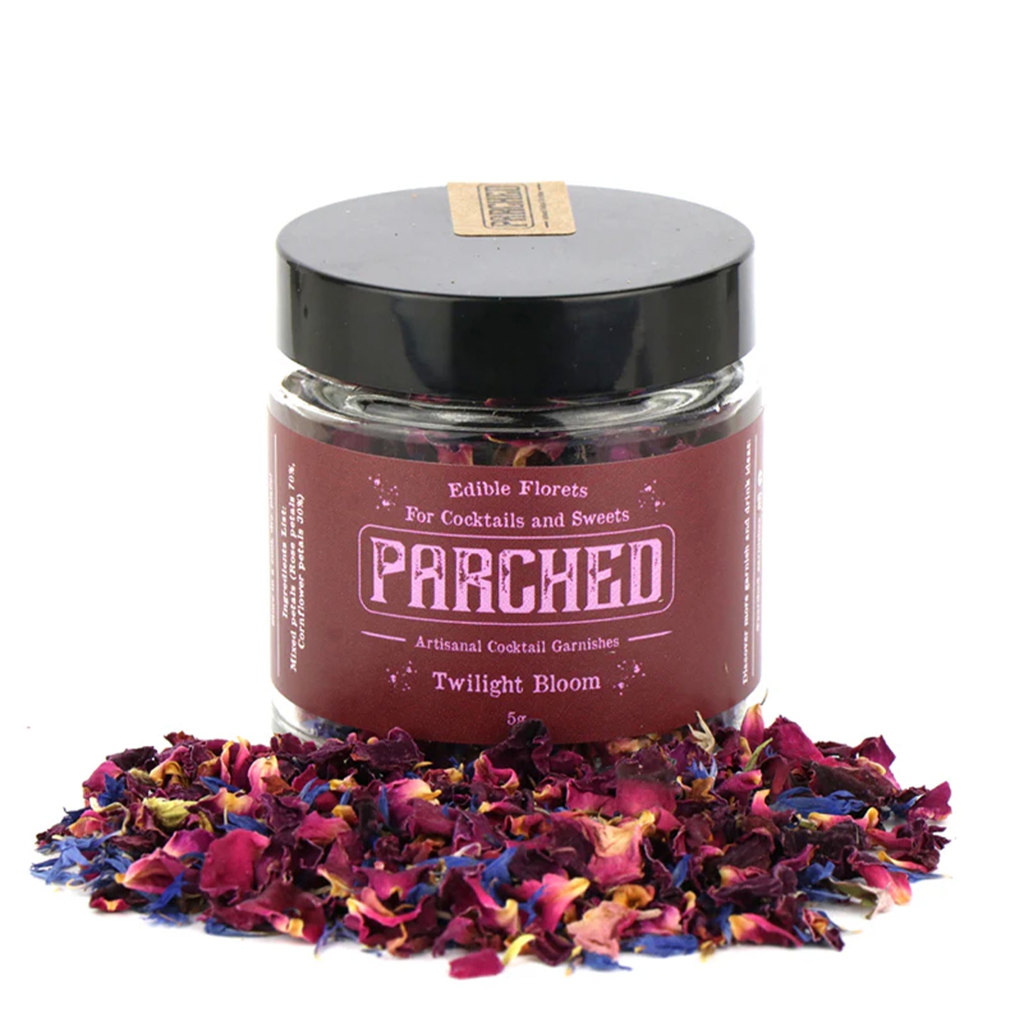 Jar of 'Parched' edible florets with colorful petals on a white background