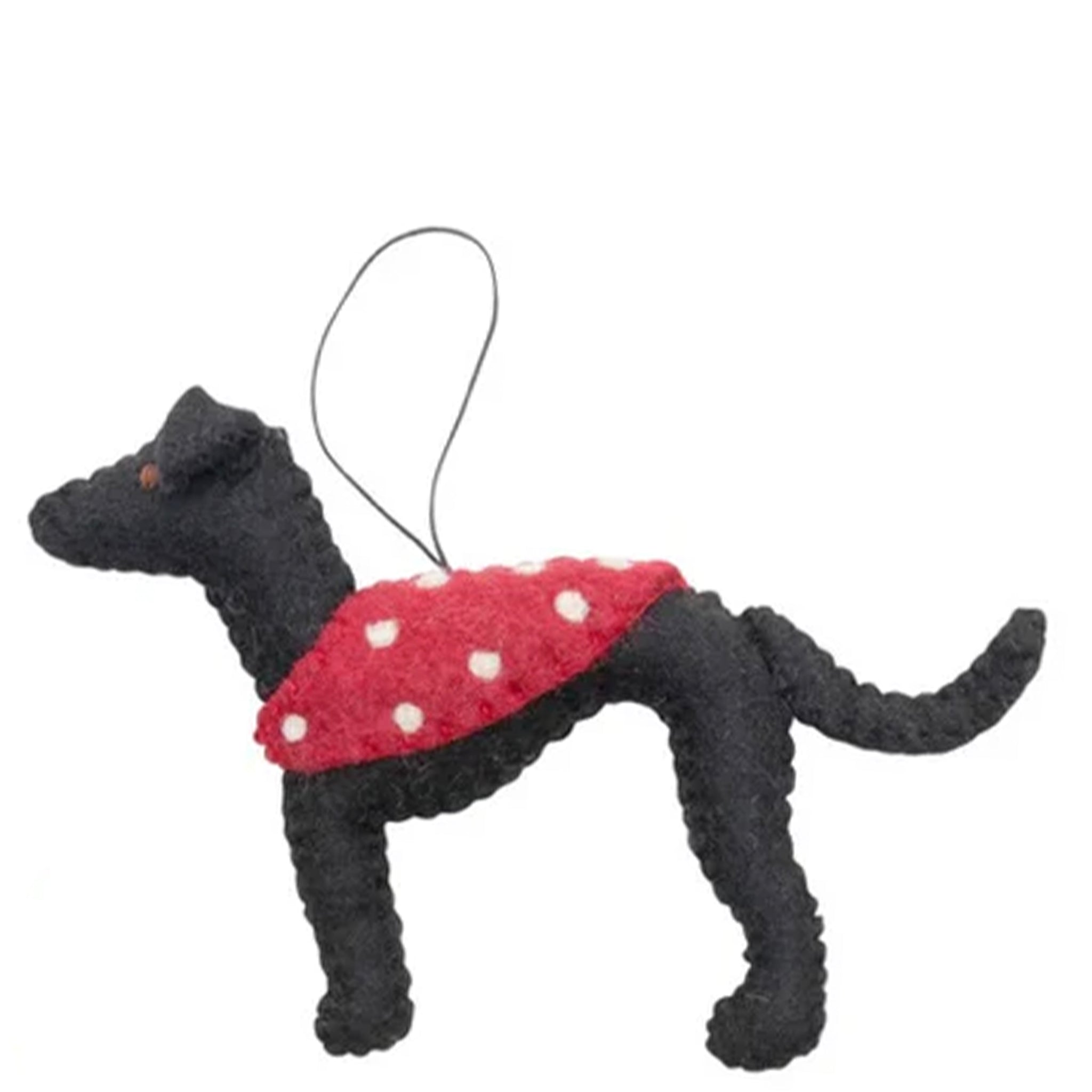 Black dog-shaped ornament with a red sweater on a white background