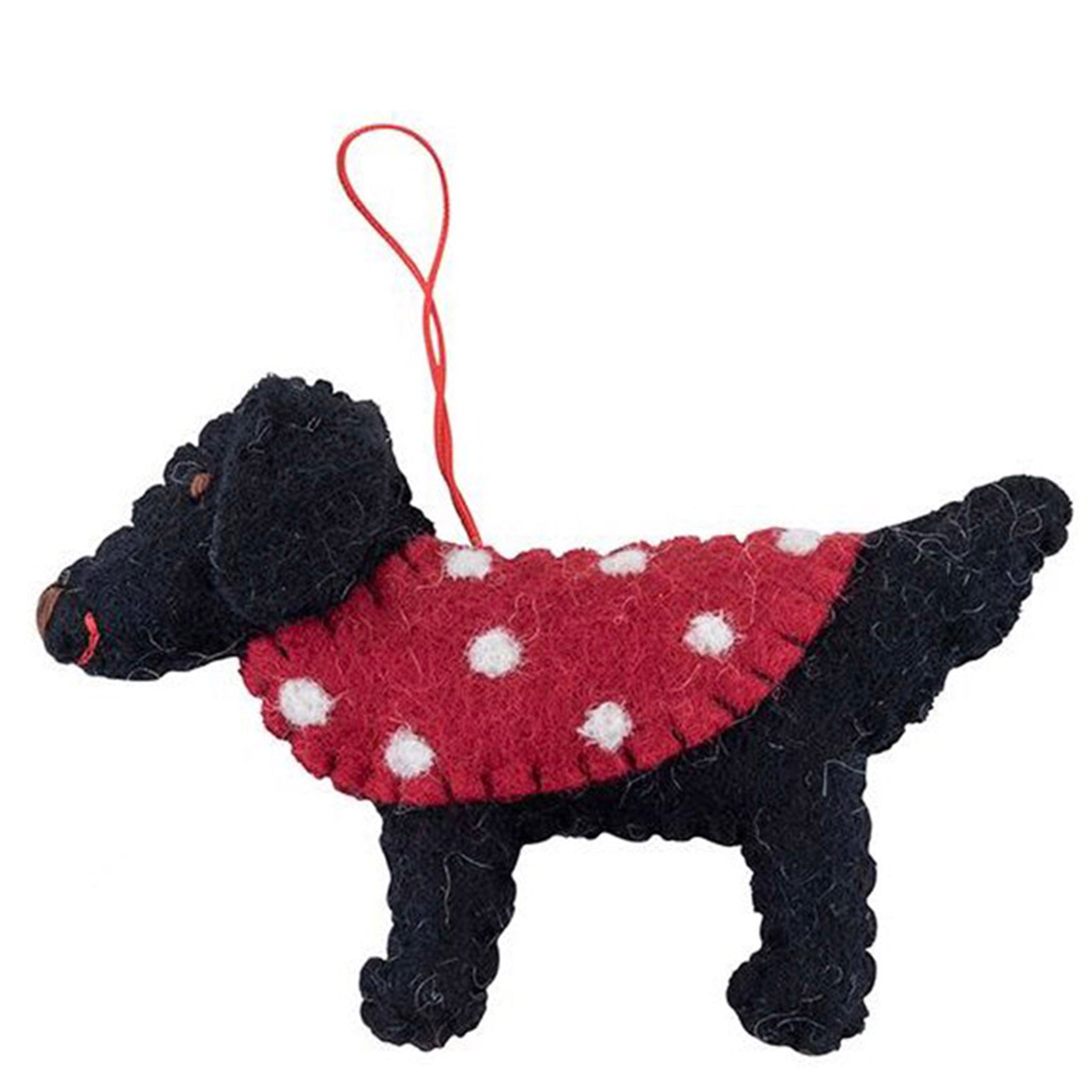 Black dog ornament with a red sweater on a white background