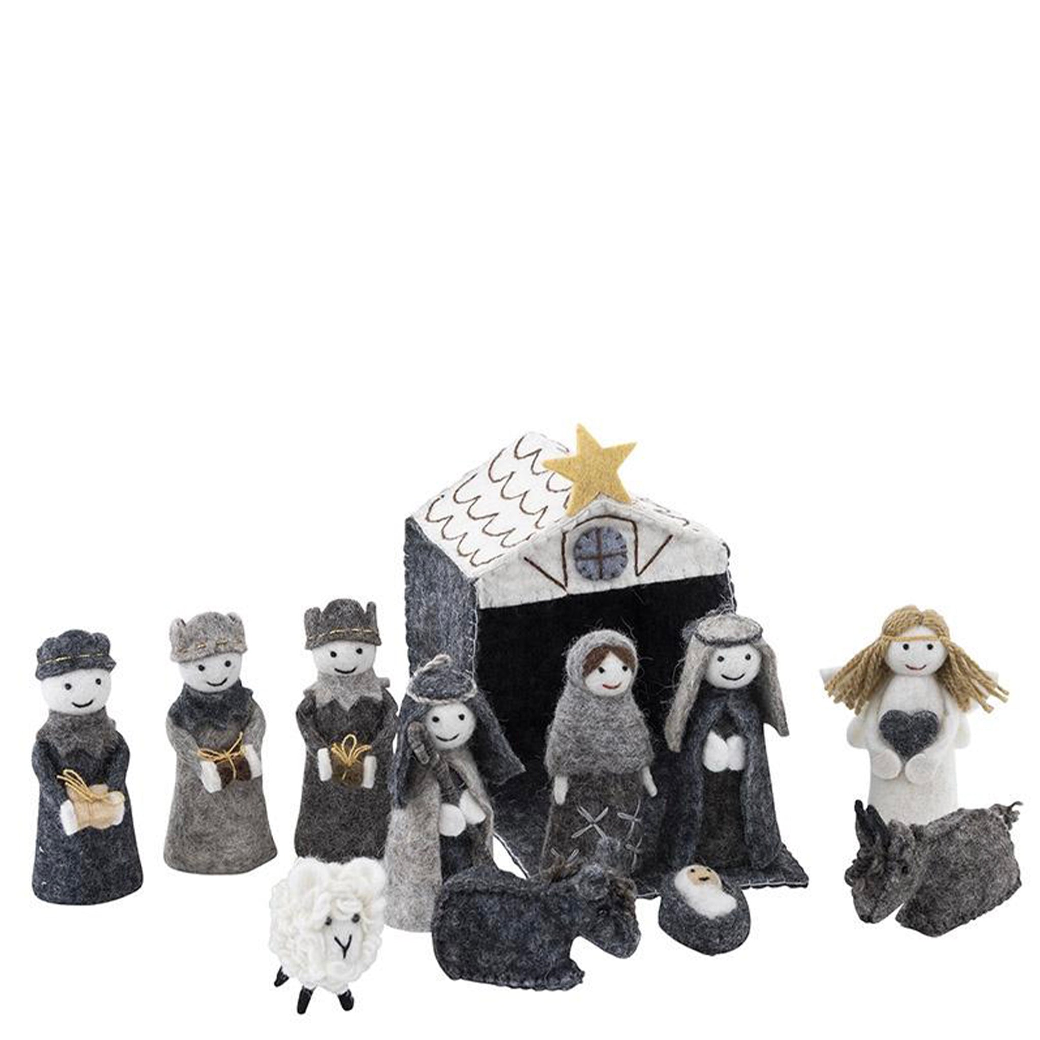 Felt nativity scene set with stable, Mary, Joseph, and other figures on a white background