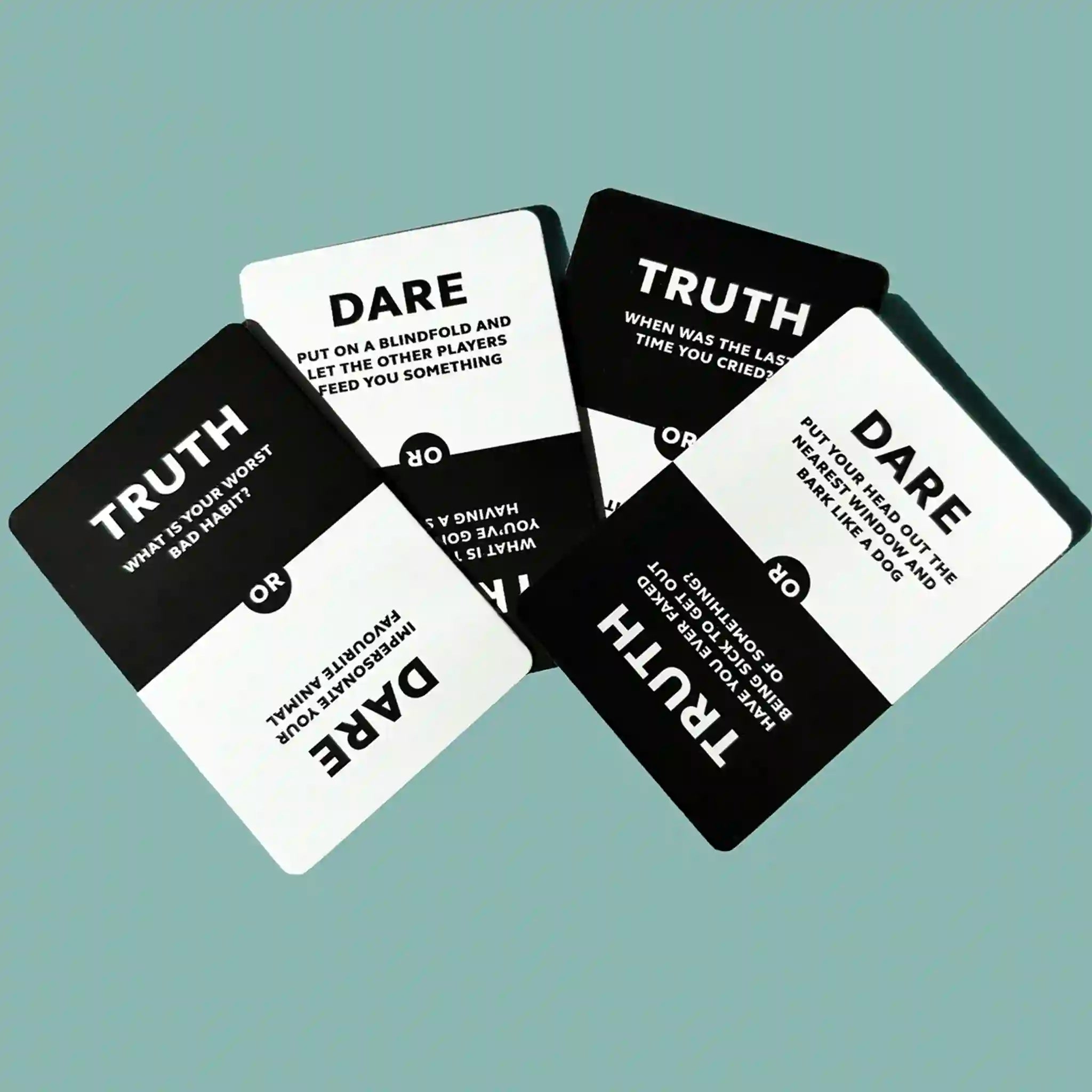 Set of 'Truth' and 'Dare' cards on a light blue background