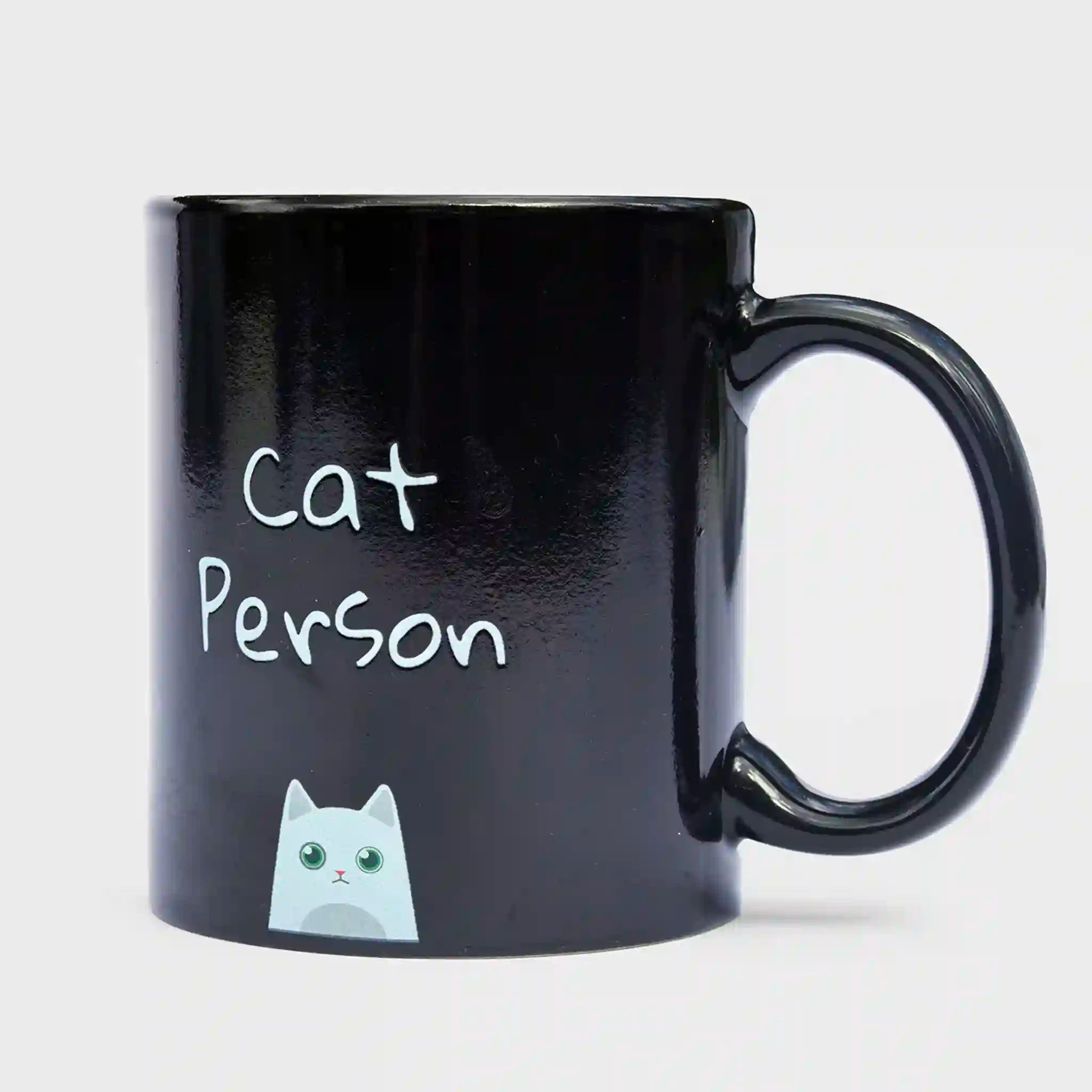 Black mug with 'Cat Person' text and a cat illustration on a light gray background