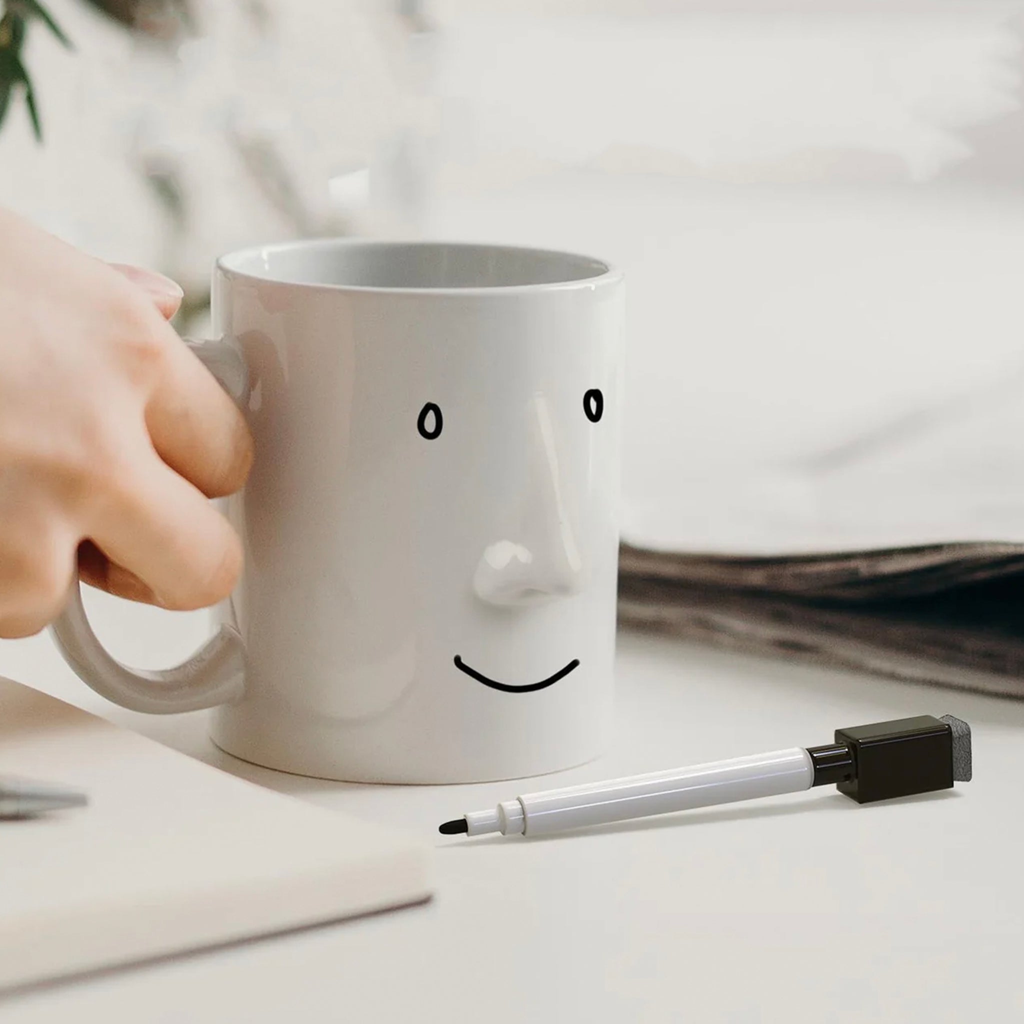 White Ceramic mug that you can draw a face on to show others your mood.