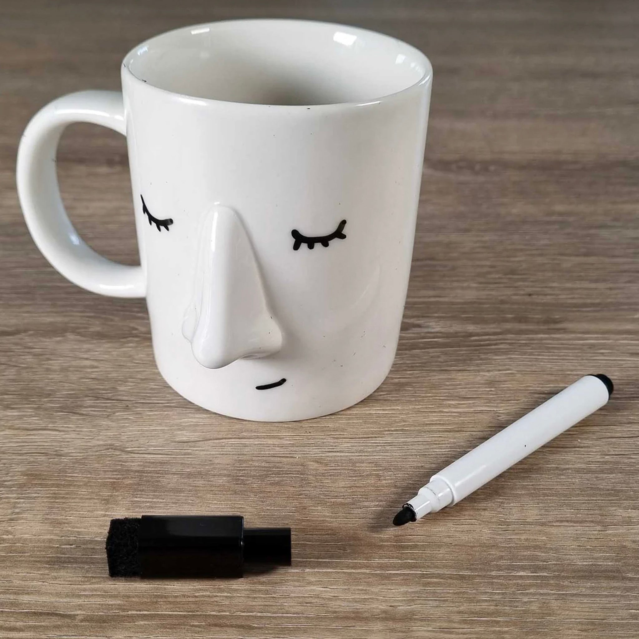 White Ceramic mug that you can draw a face on to show others your mood.