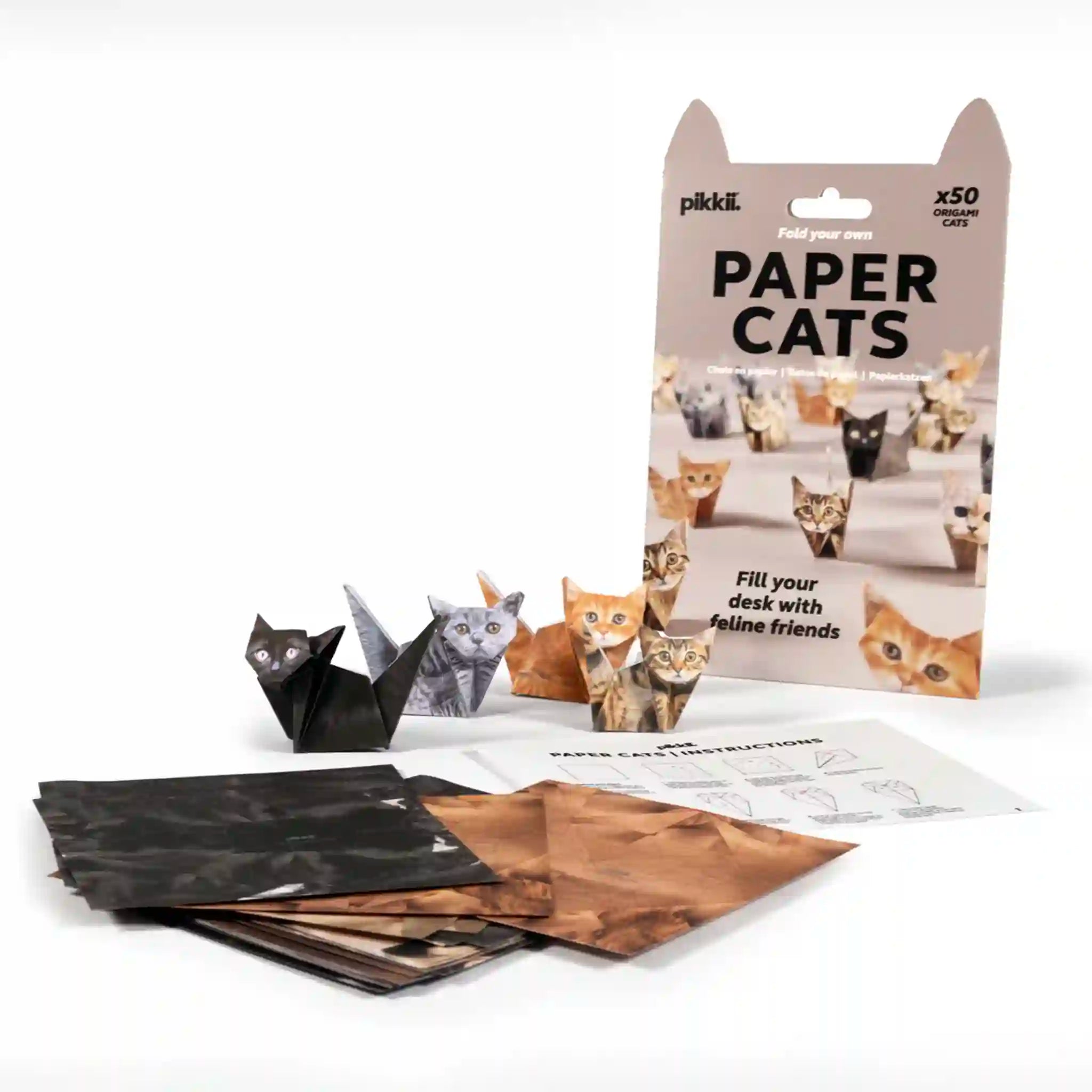 Packaging of paper cats with instructions on a white background