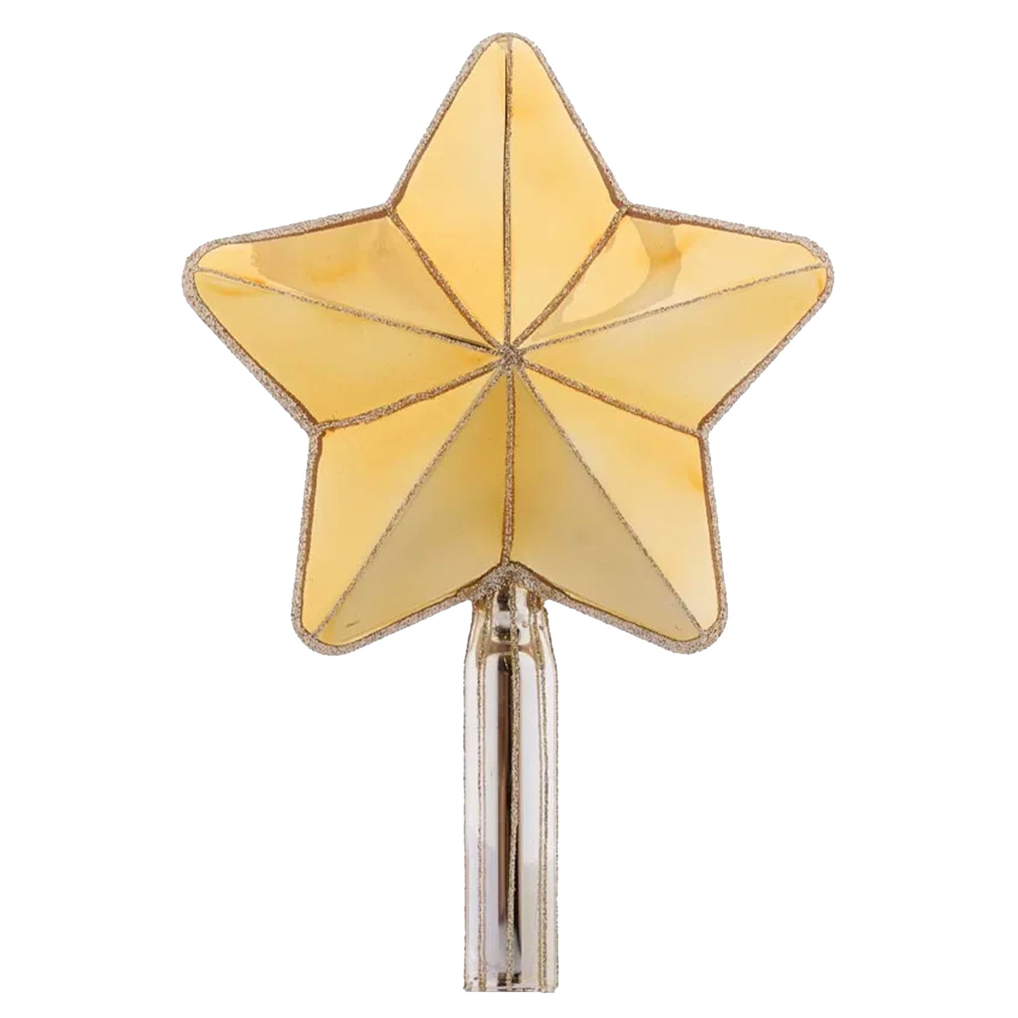 Gold star-shaped tree topper on a white background