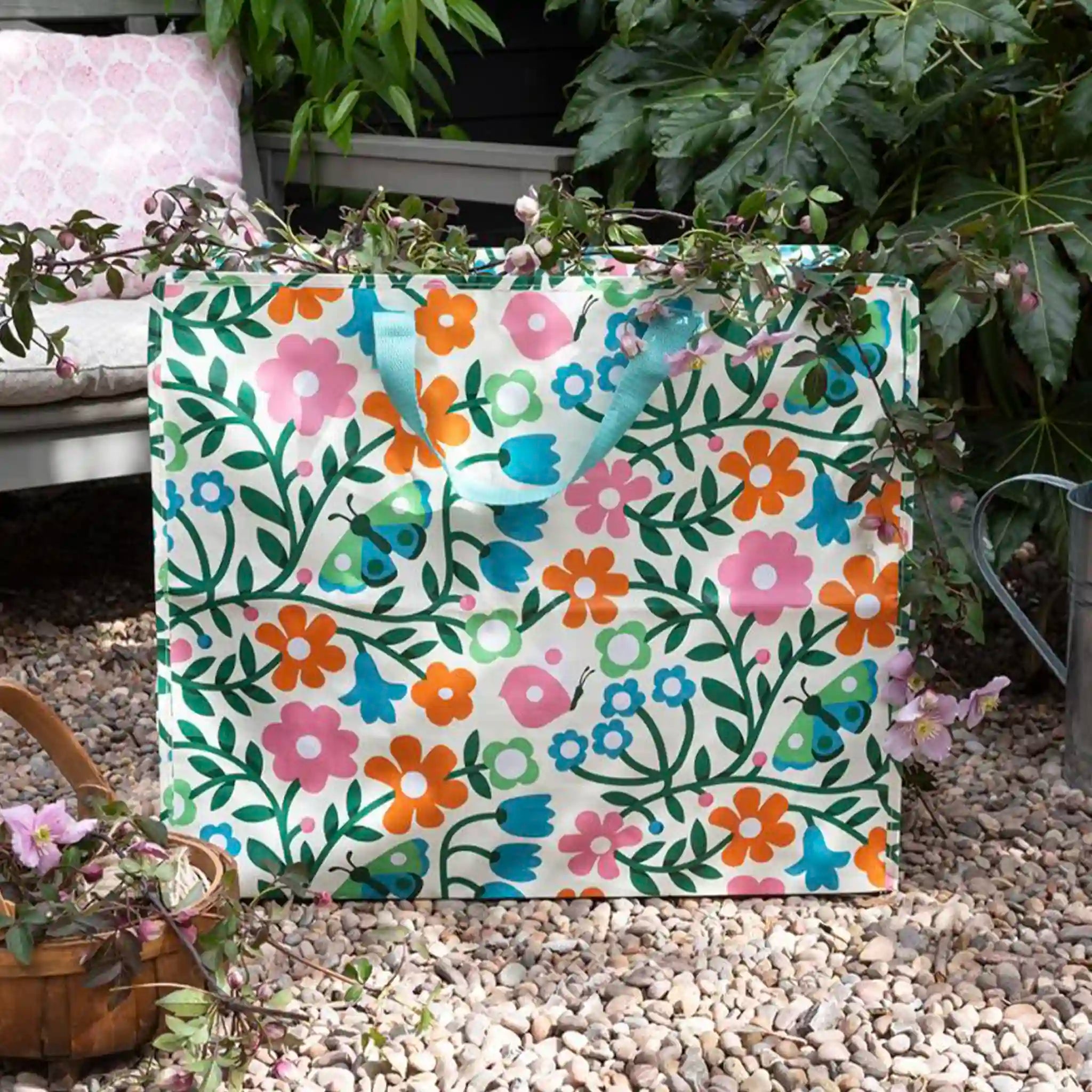 Floral-patterned bag with flowers and butterflies on a garden background