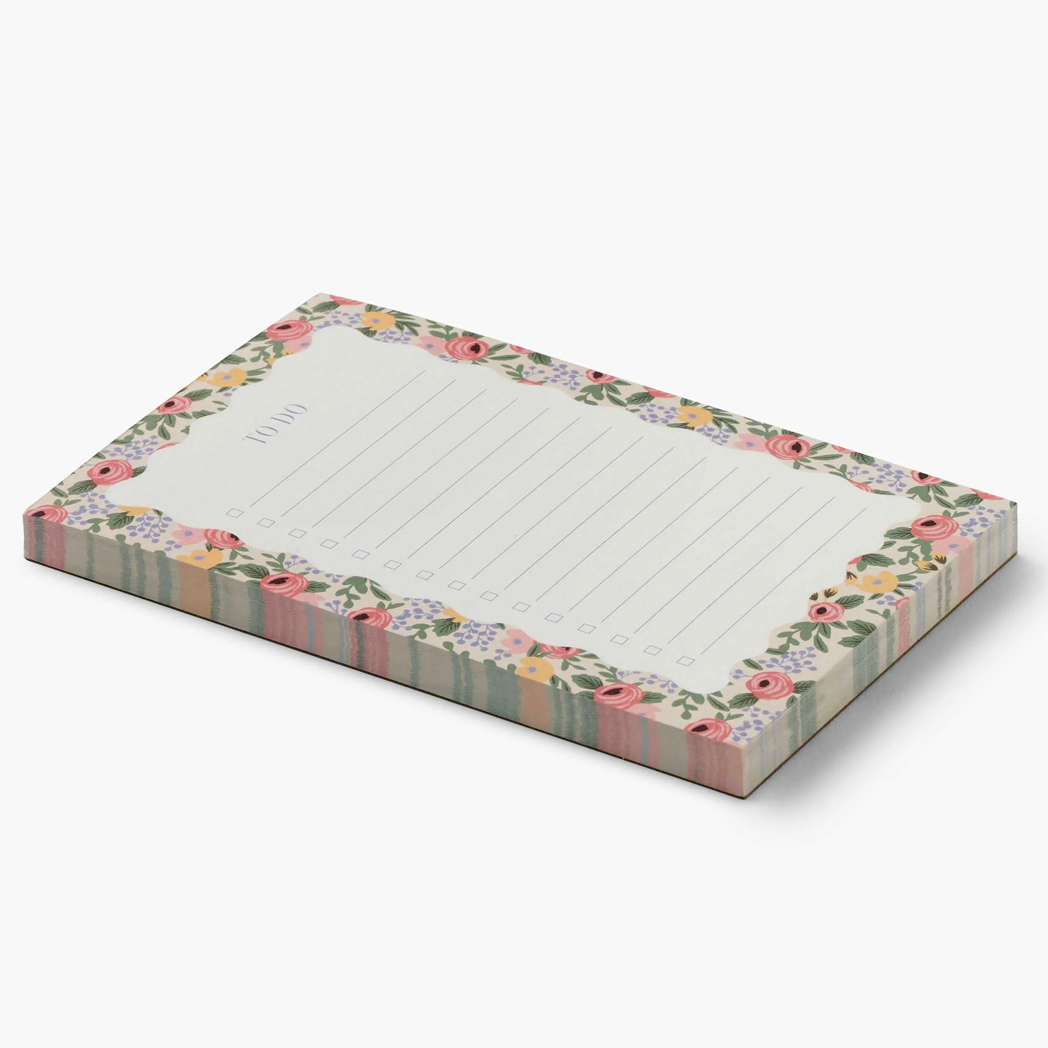 Floral notepad with lined paper on a white background
