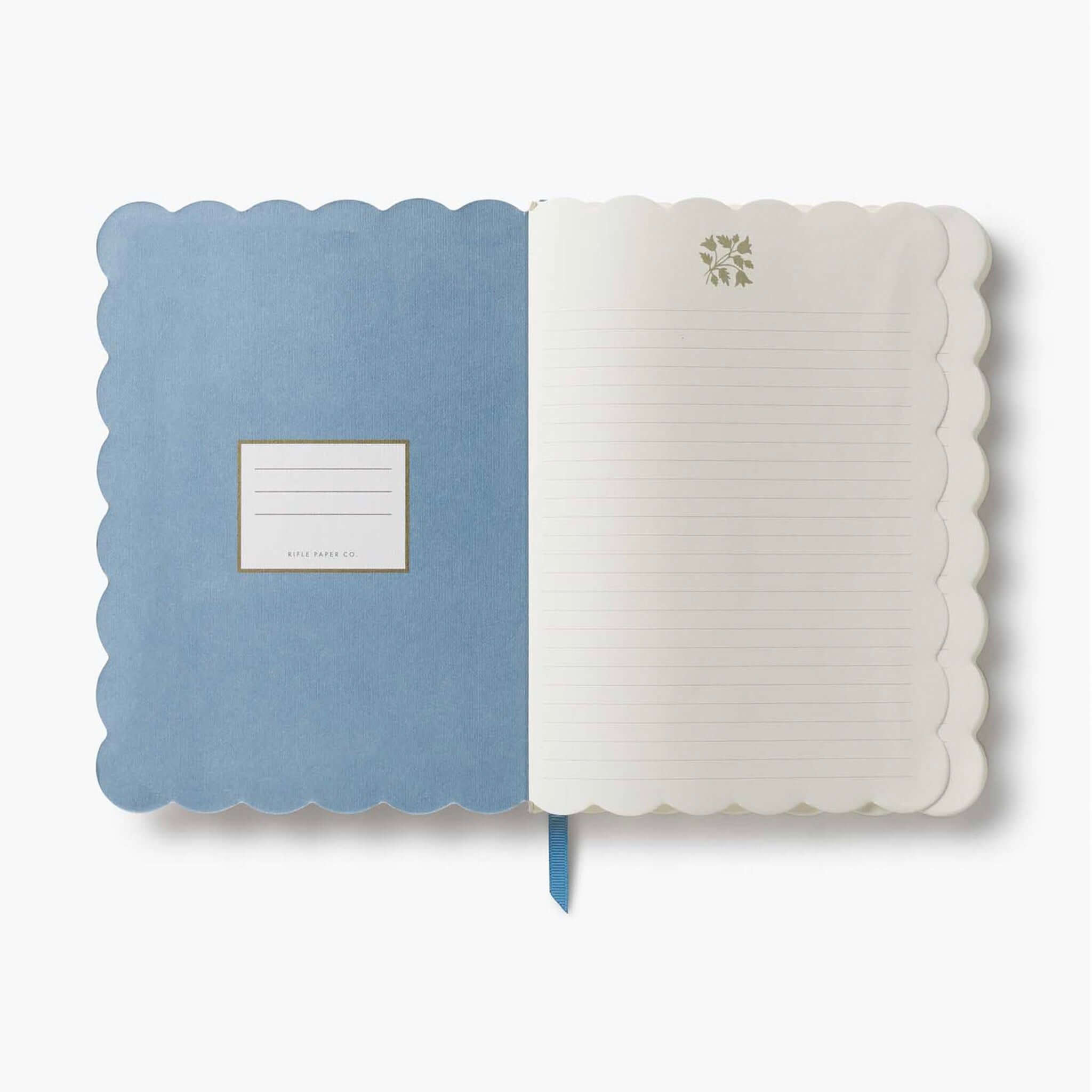 Interior view of the Rifle Paper Softcover Journal - Helena showcasing its scalloped edges and lined pages.