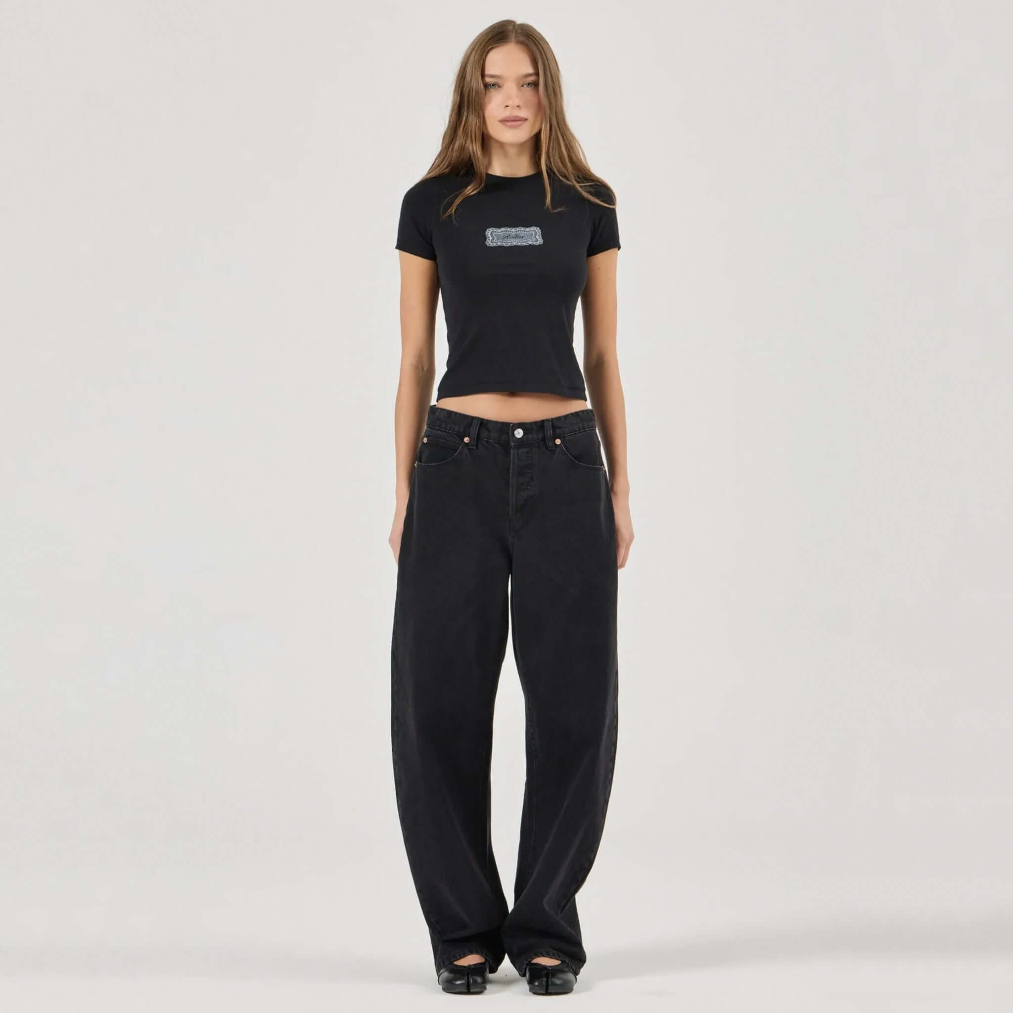 Rolla's Arc Barrel Jeans - Black Sand on model, mid-rise relaxed fit 100% cotton denim barrel leg silhouette