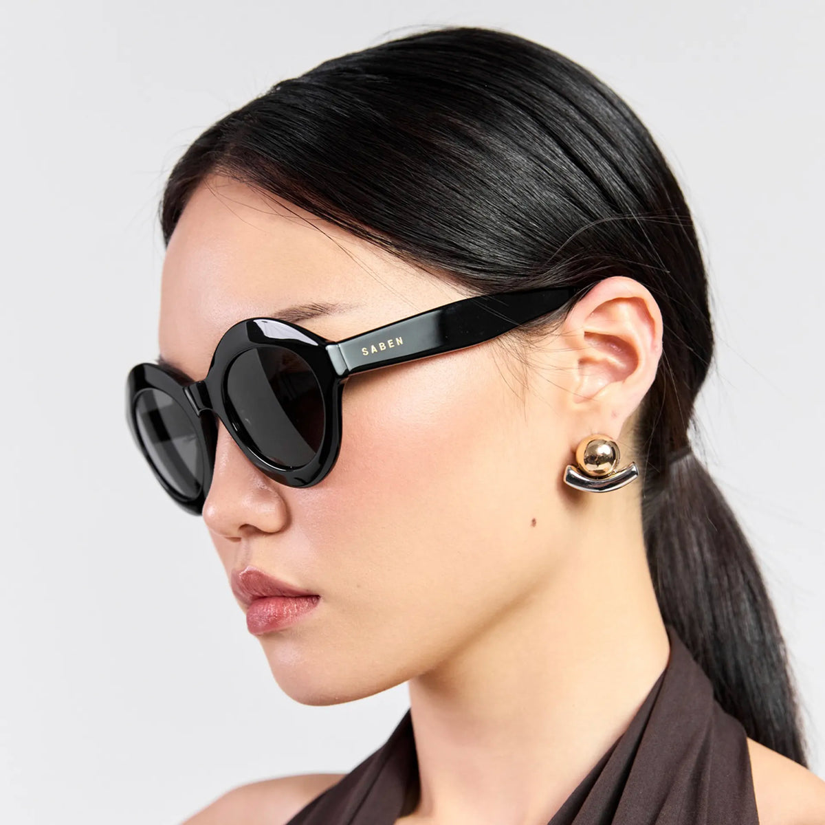 Saben Eyewear Cosmo Sunglasses in Black - angular cat-eye acetate frames with dark lenses