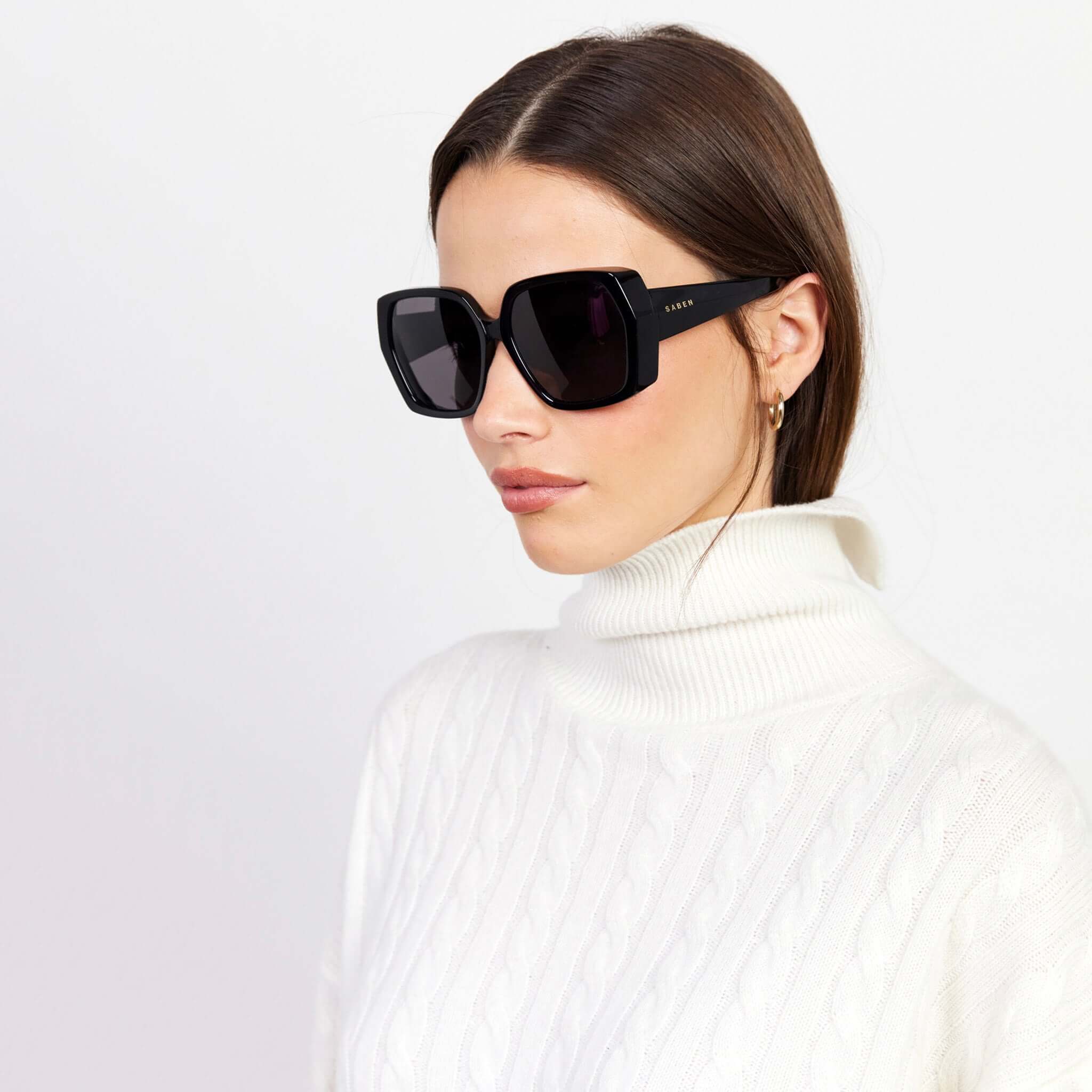 Alt Tag: Saben Eyewear Remi Sunglasses - Black oversized hexagonal acetate sunglasses on model, bold 70s-inspired style