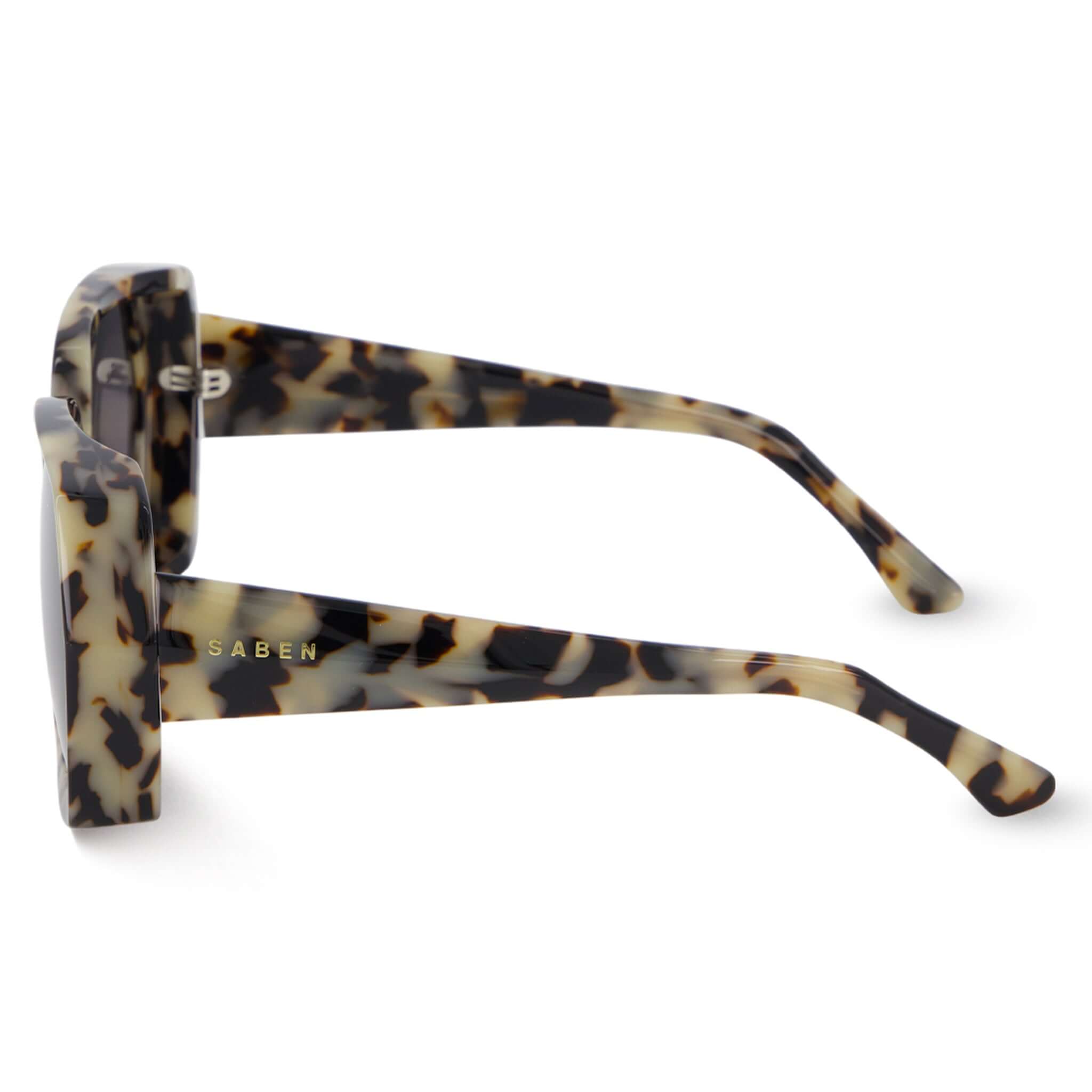 Alt Tag: Saben Eyewear Remi Sunglasses - Light Tortoise side view, oversized hexagonal acetate frame with bevelled detail and inset 5-barrel hinge