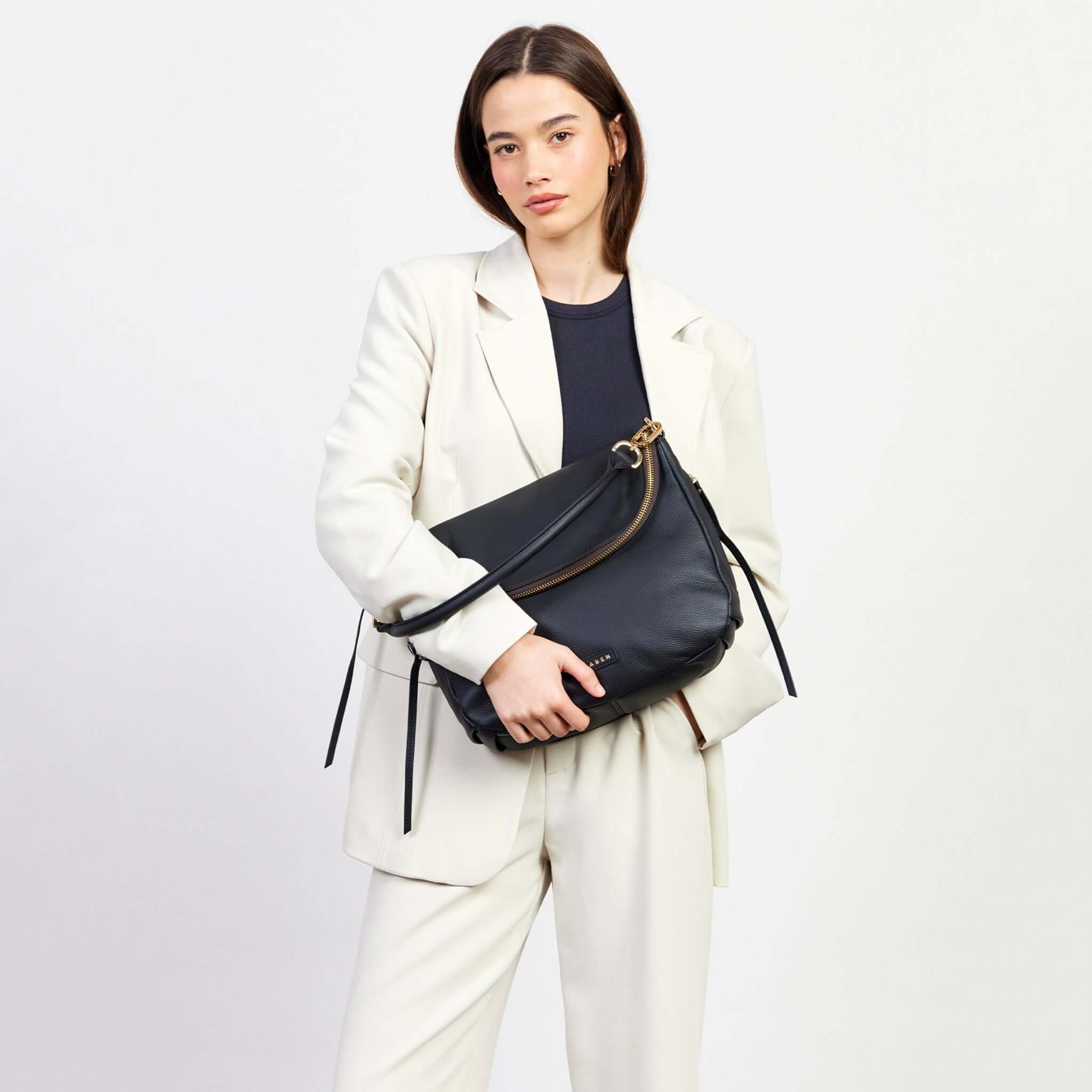 Saben Frankie Shoulder Bag - Black slouchy pebbled leather shoulder bag with oversized front flap and zip compartment, worn crossbody