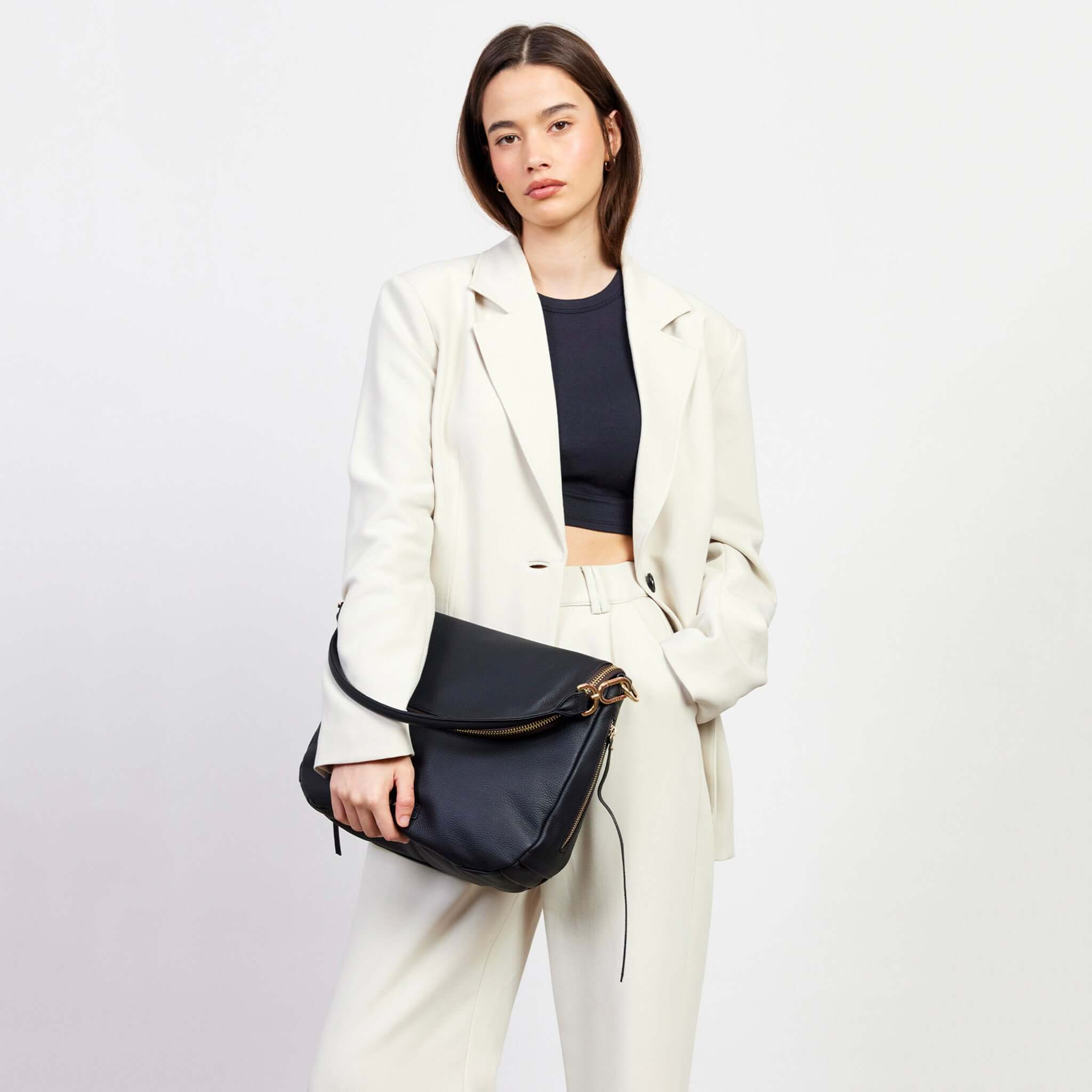 Alt Tag: Saben Frankie Shoulder Bag - Black slouchy black leather shoulder bag with oversized front flap and separate zip compartment