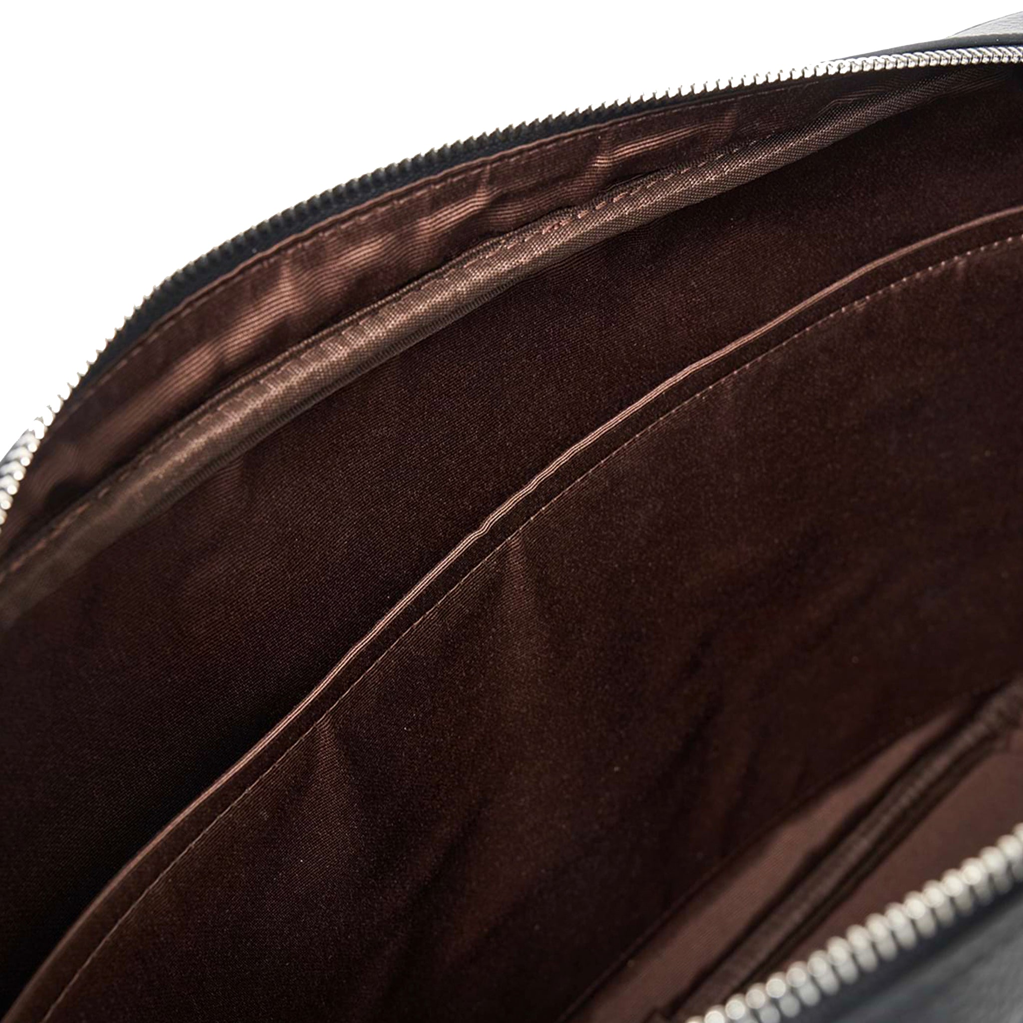 Interior of a black Saben briefcase on a white background.