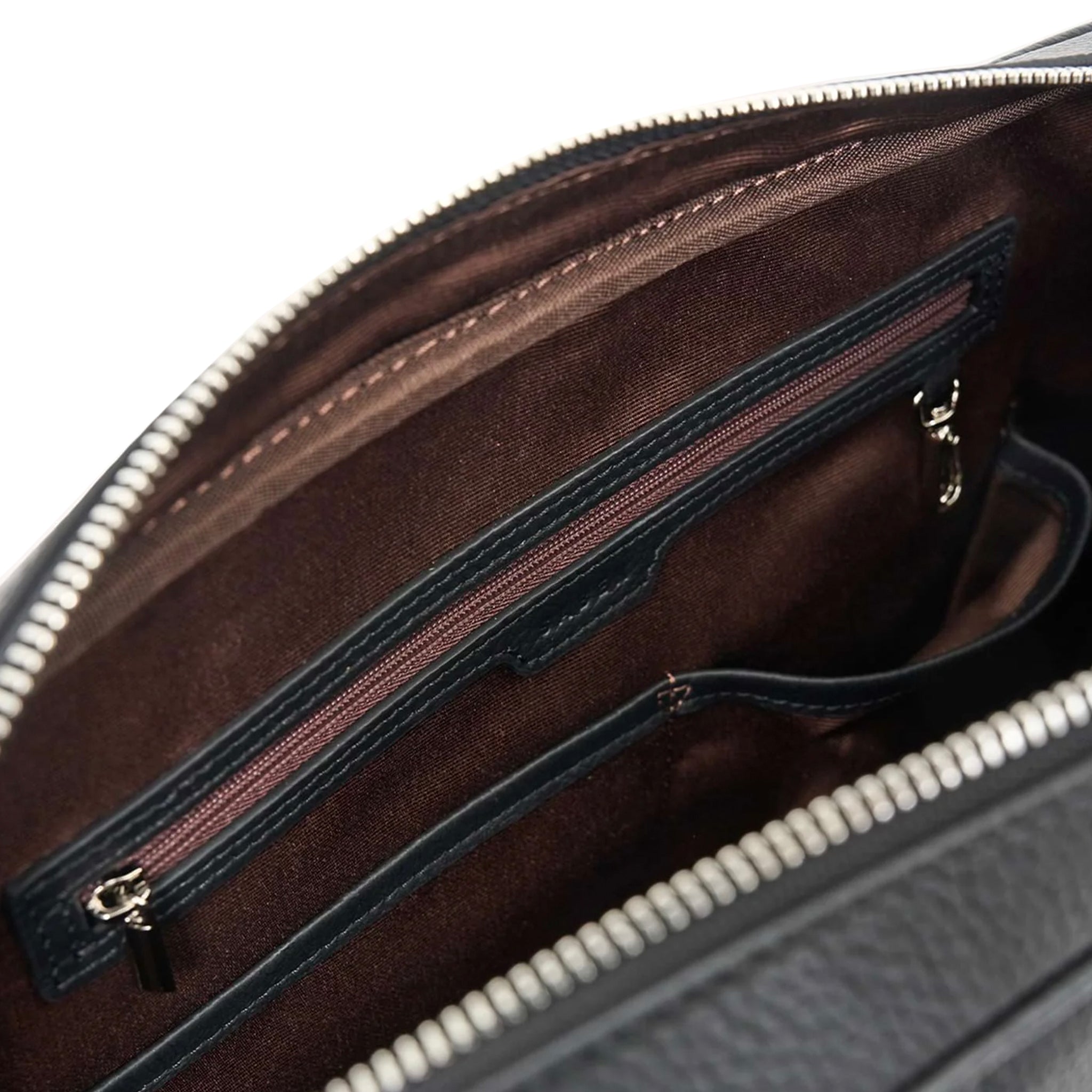 Interior of a black Saben briefcase on a white background.