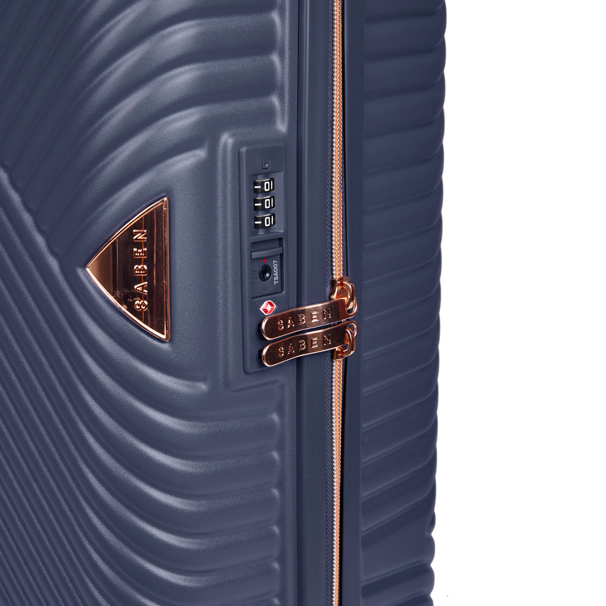 Navy blue suitcase with rose gold accents and a visible brand logo on a white background