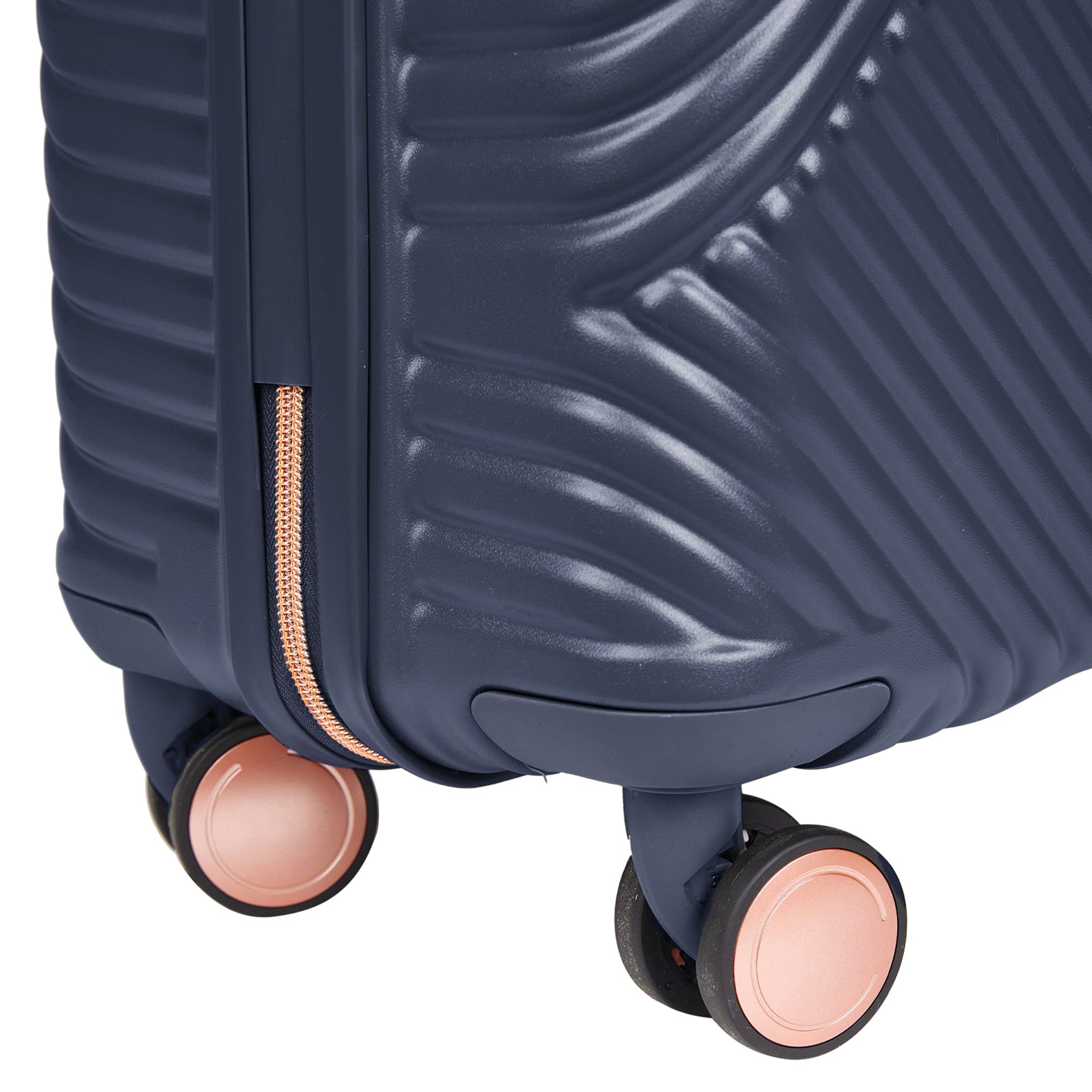 Navy blue suitcase with pink wheels on a white background