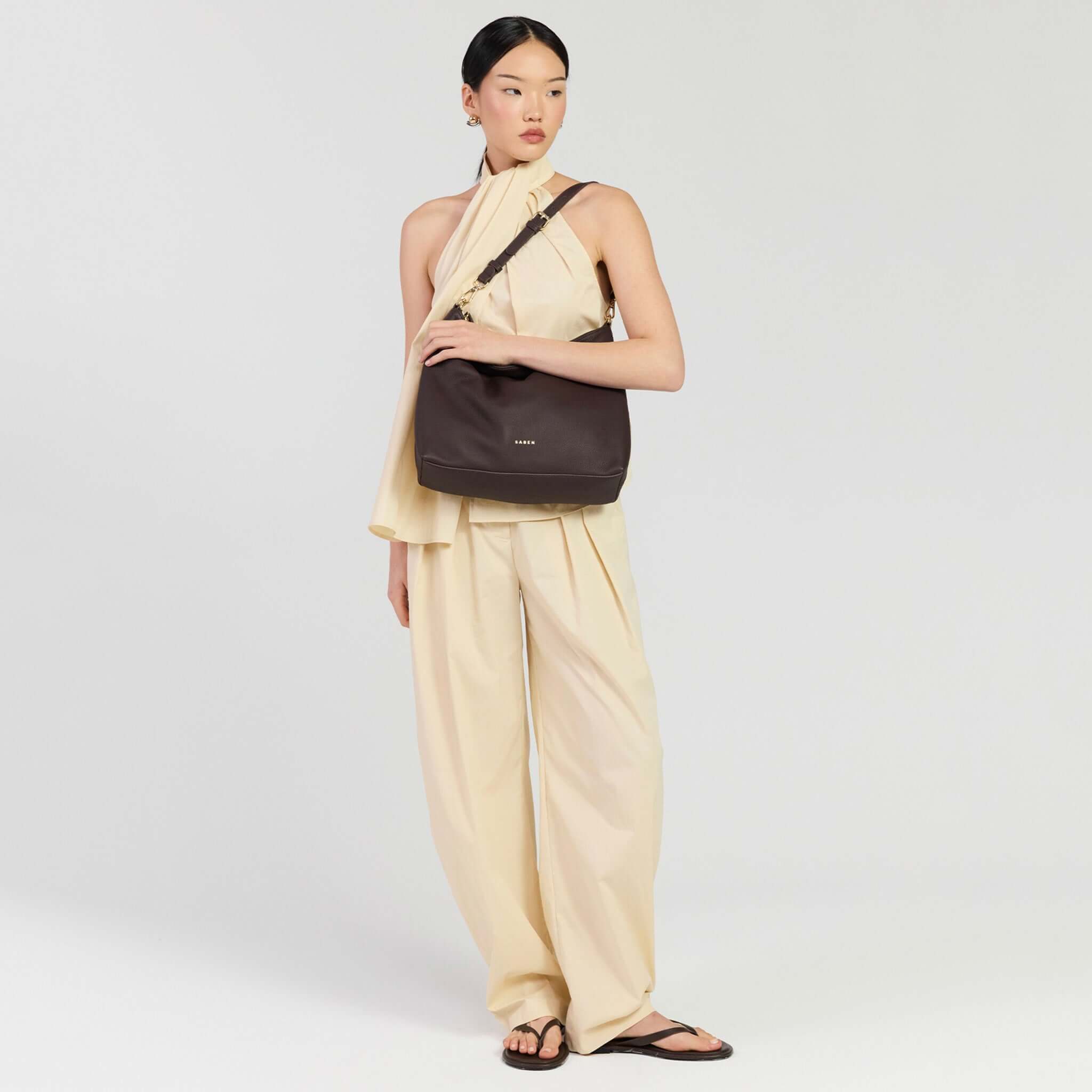 Saben Miki Shoulder Bag - Cacao Luxe worn by model in stylish outfit, showcasing its elegance and versatility.