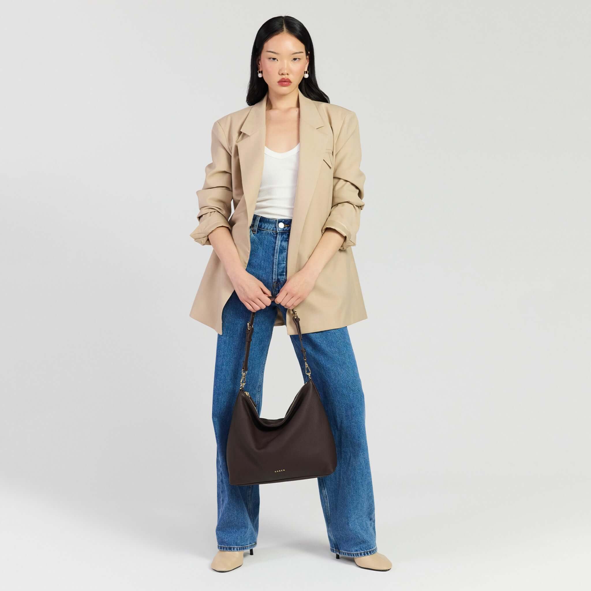 Saben Miki Shoulder Bag - Cacao Luxe showcased with stylish outfit in a light background.